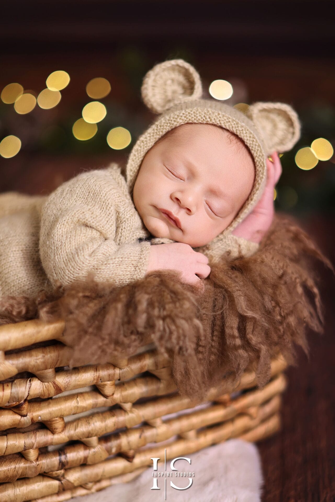Newborn Christmas edition photoshoot in London studio, featuring festive props and elegant holiday décor.
