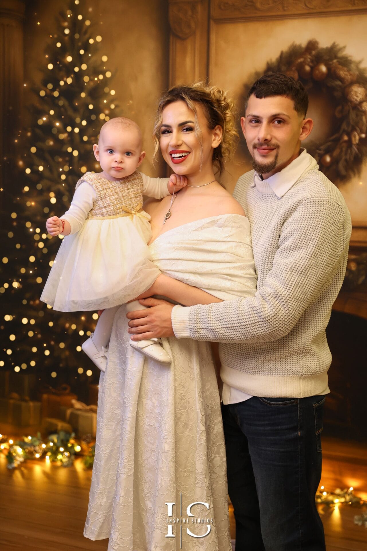 Elegant family Christmas portraits with luxury festive décor