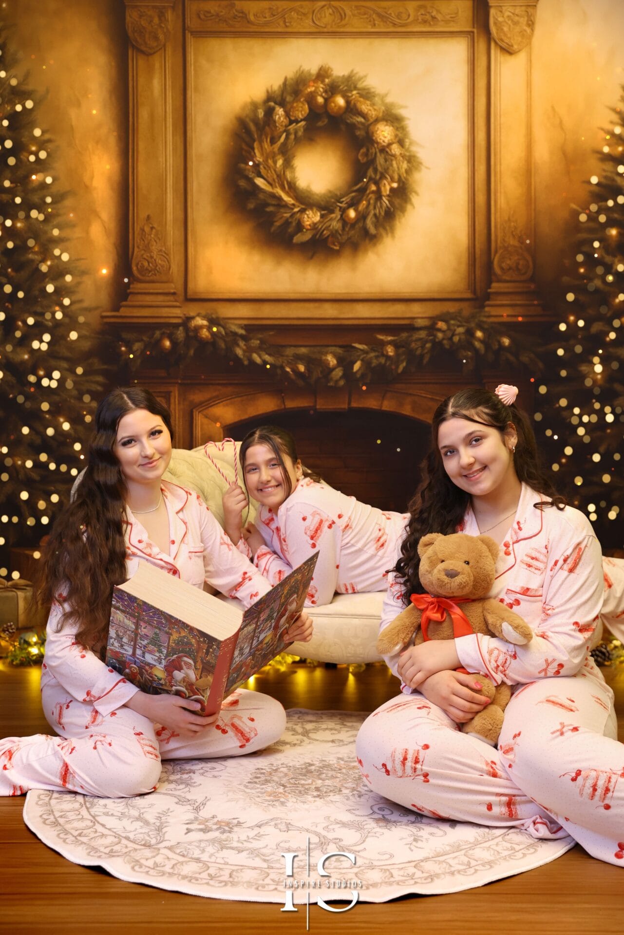 Elegant sisters Christmas portraits in a luxury holiday studio