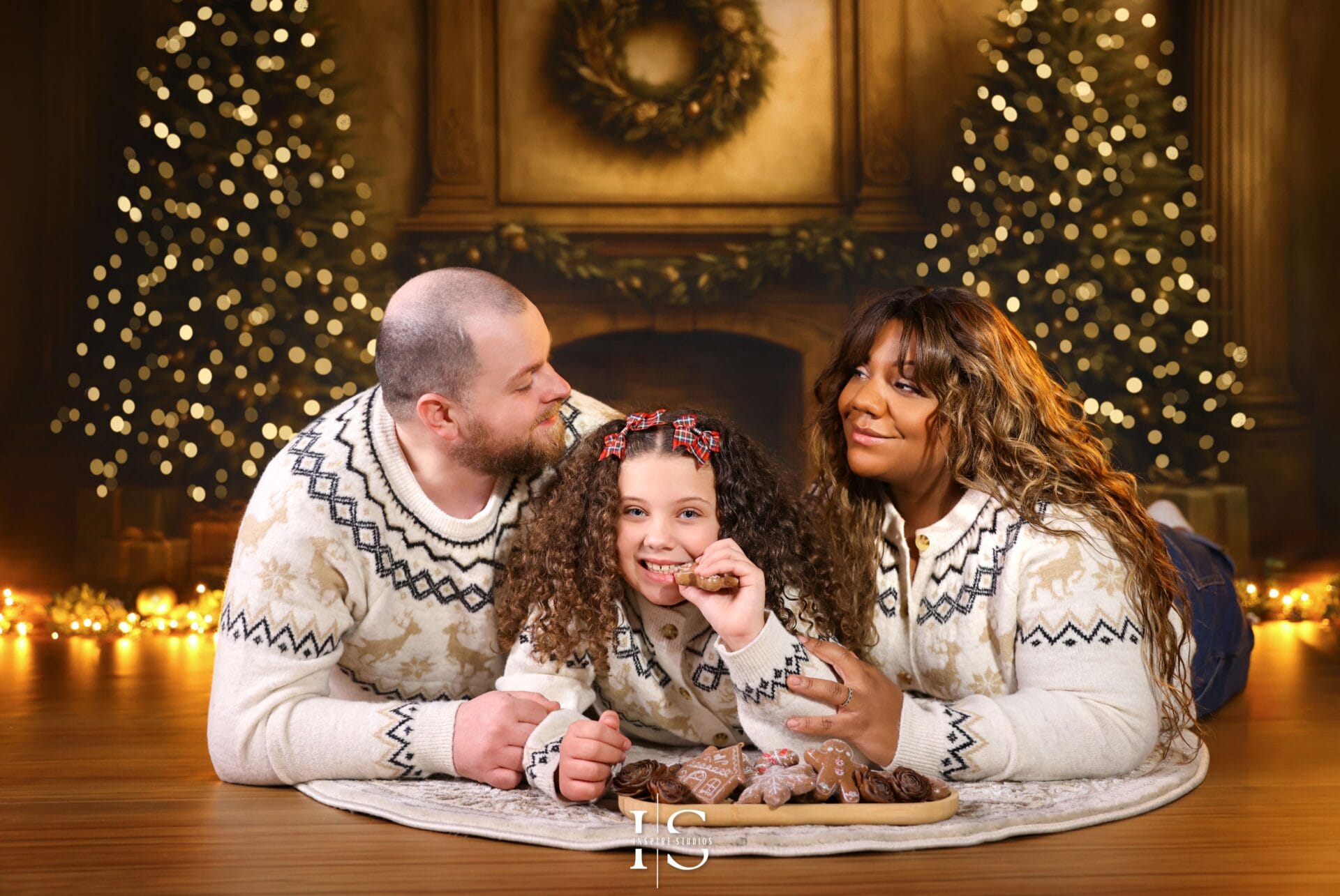 Family Christmas photoshoot near me in London at Inspire Studios with warm holiday décor and festive portrait styling.
