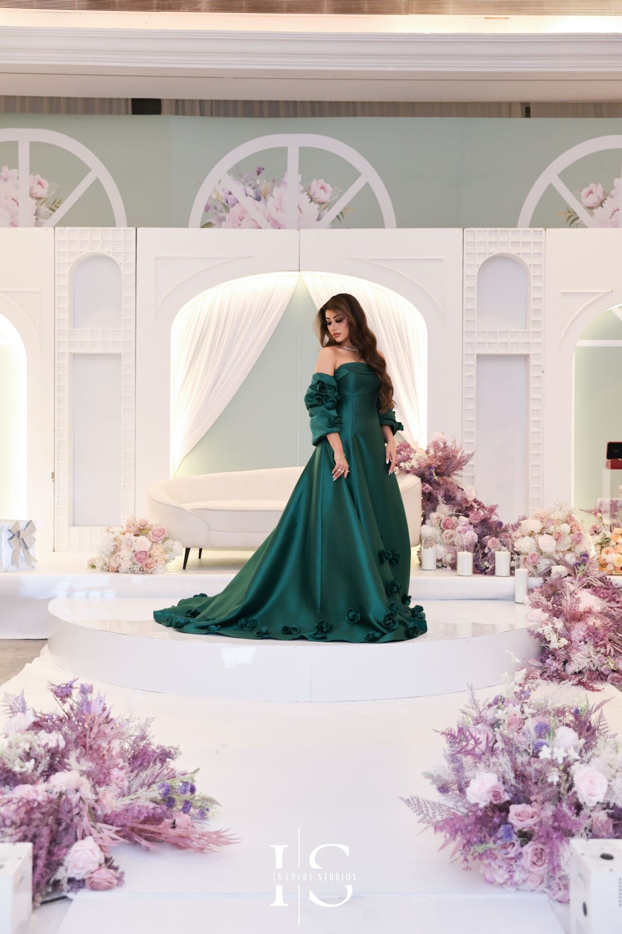 Female luxury wedding photographer capturing an emotional ceremony with vows, guests, floral details, and elegant venue styling.