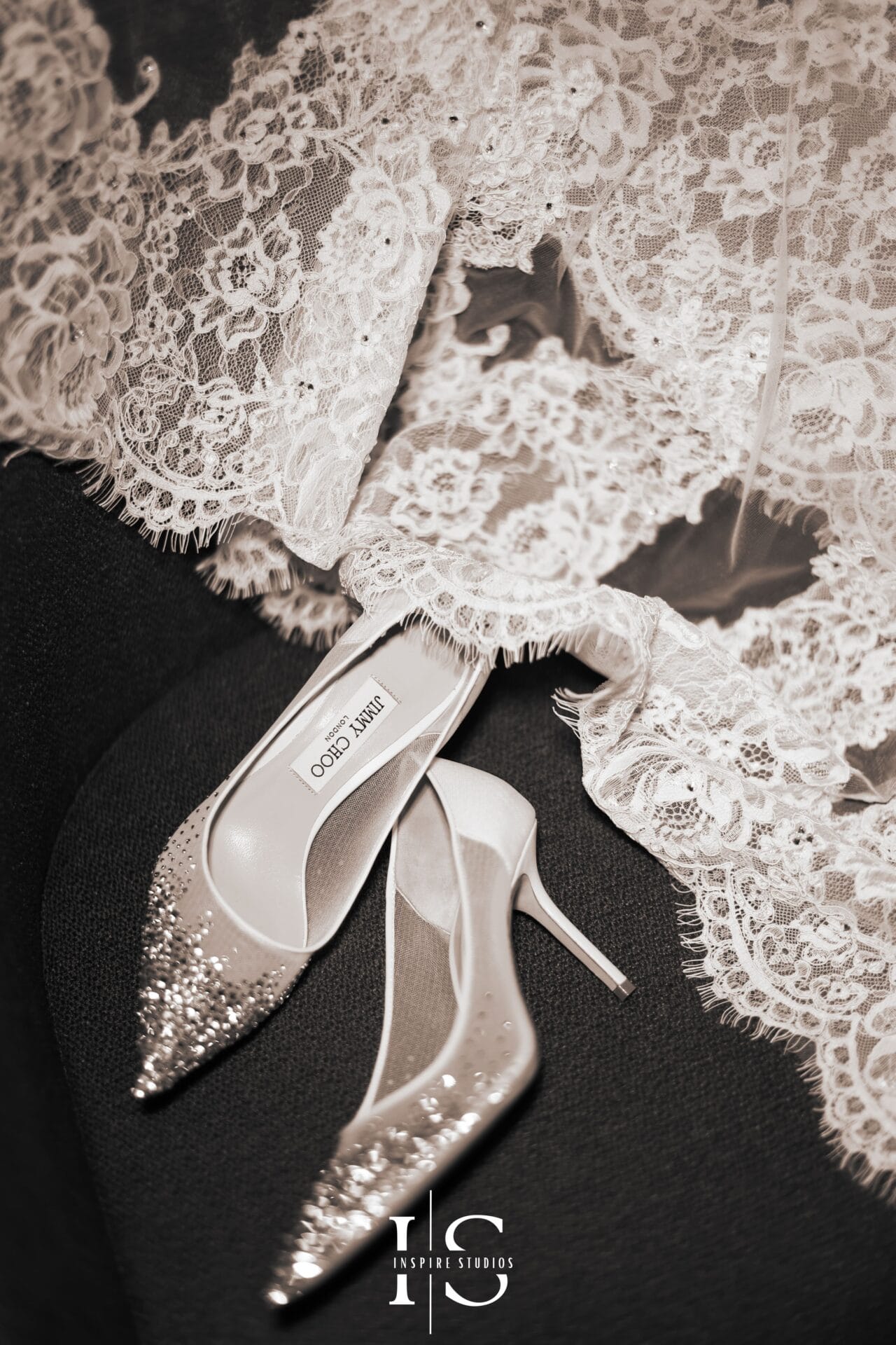 Female photographer for luxury weddings capturing elegant bridal portraits, refined details, and emotional celebration moments.
