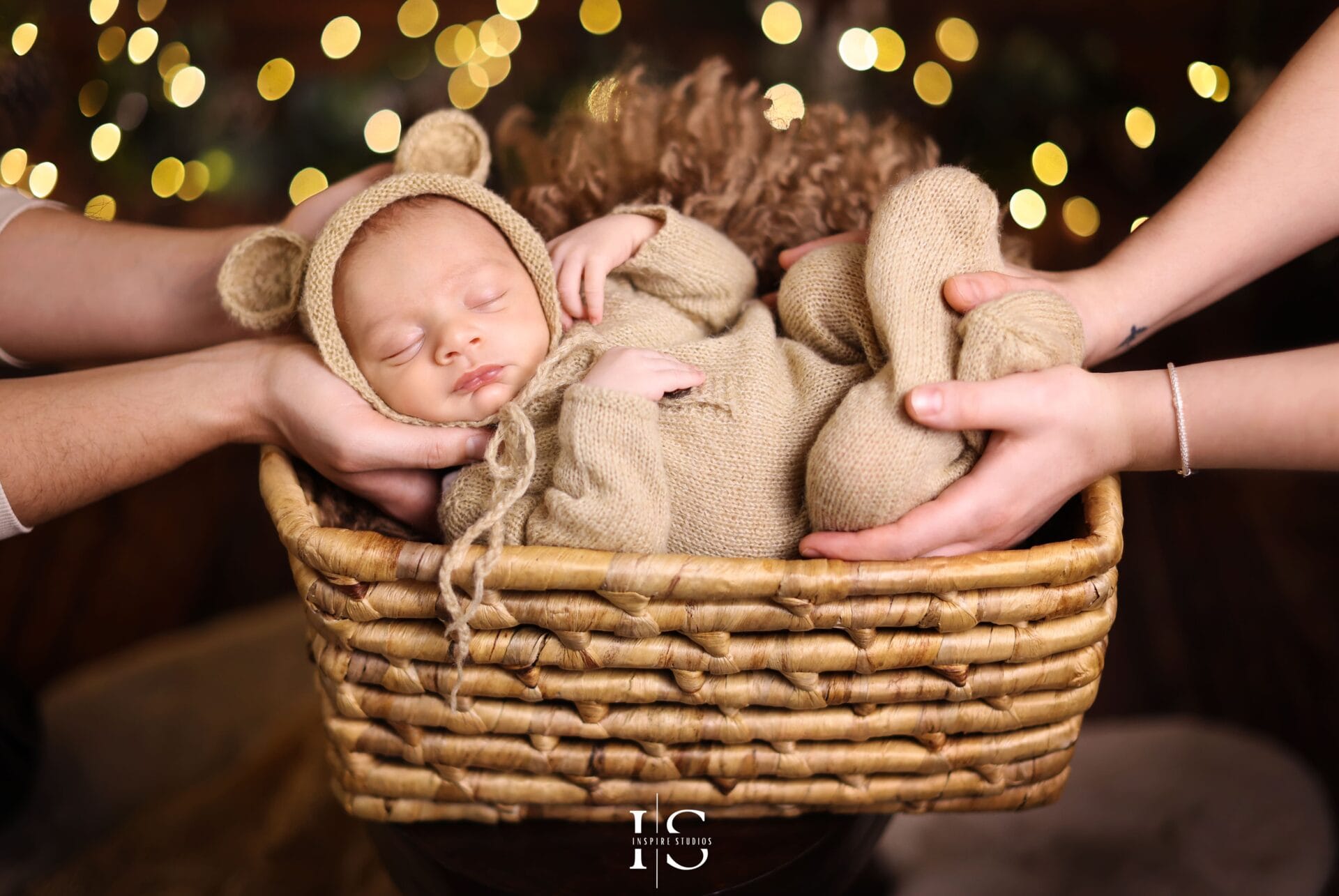 Festive family and newborn Christmas photoshoot in London studio with holiday décor and cozy seasonal outfits