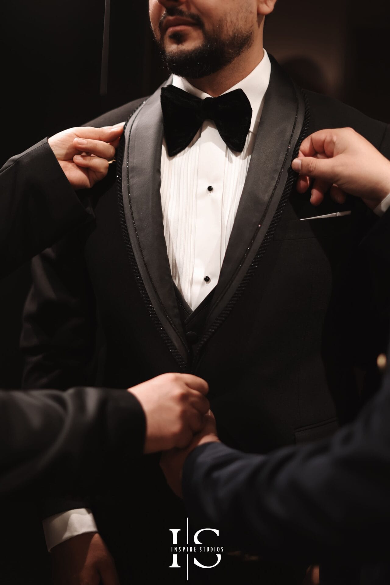 Groom close up luxury wedding photography at Marriott Grosvenor Square London capturing cufflinks, watch, suit, and boutonnière details.