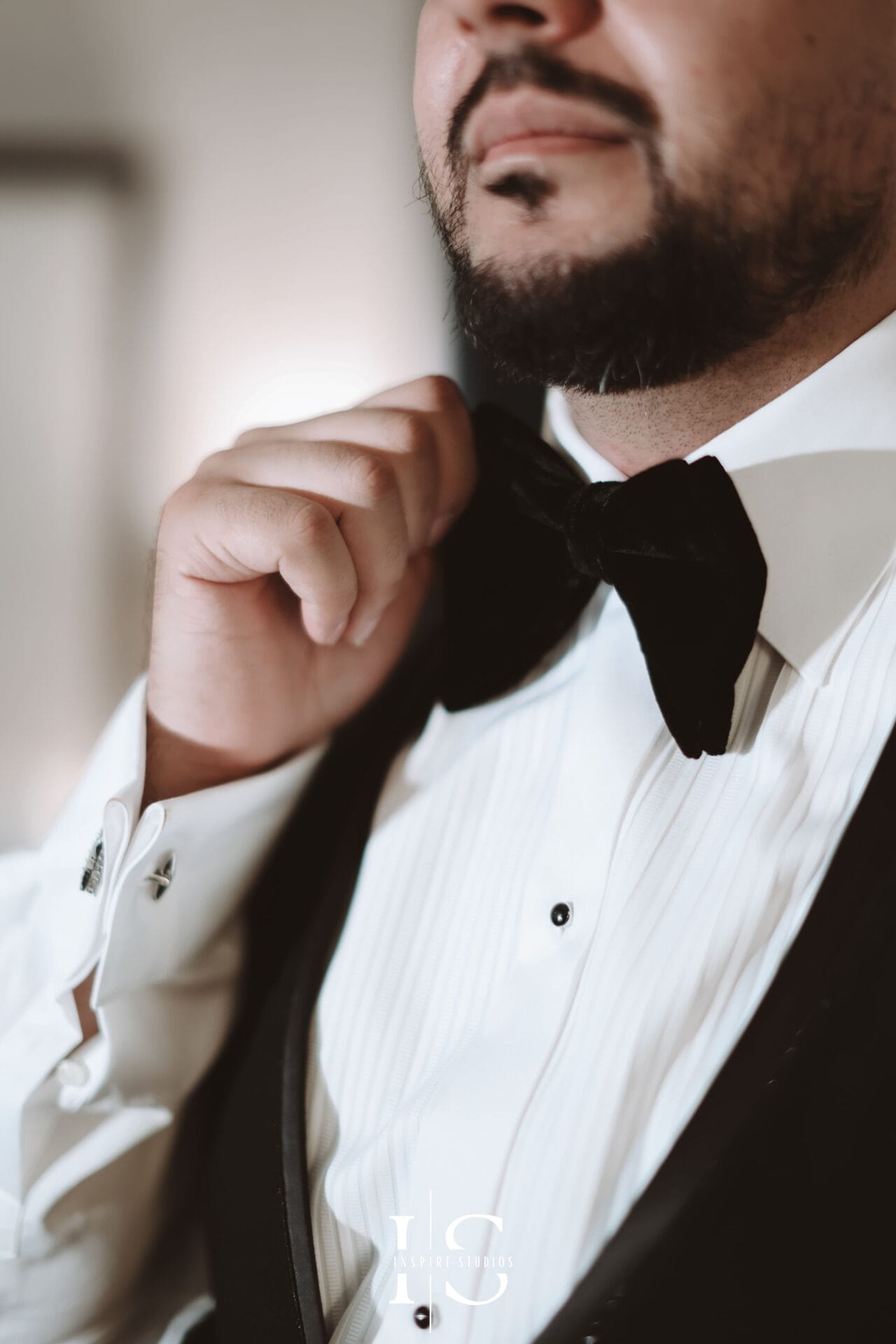 Groom close up luxury wedding photography at Marriott Grosvenor Square capturing suit, cufflinks, watch, and refined details.