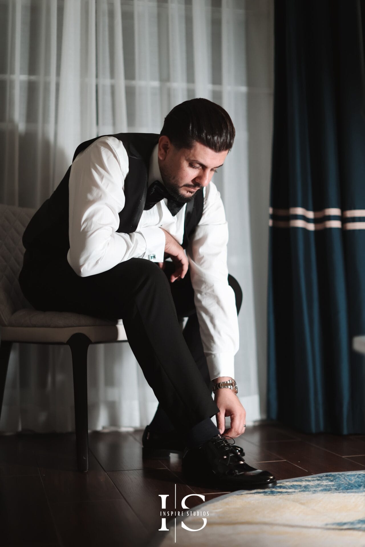 Luxury wedding photography groom portrait capturing elegant styling, tailored suit, and timeless wedding day confidence.