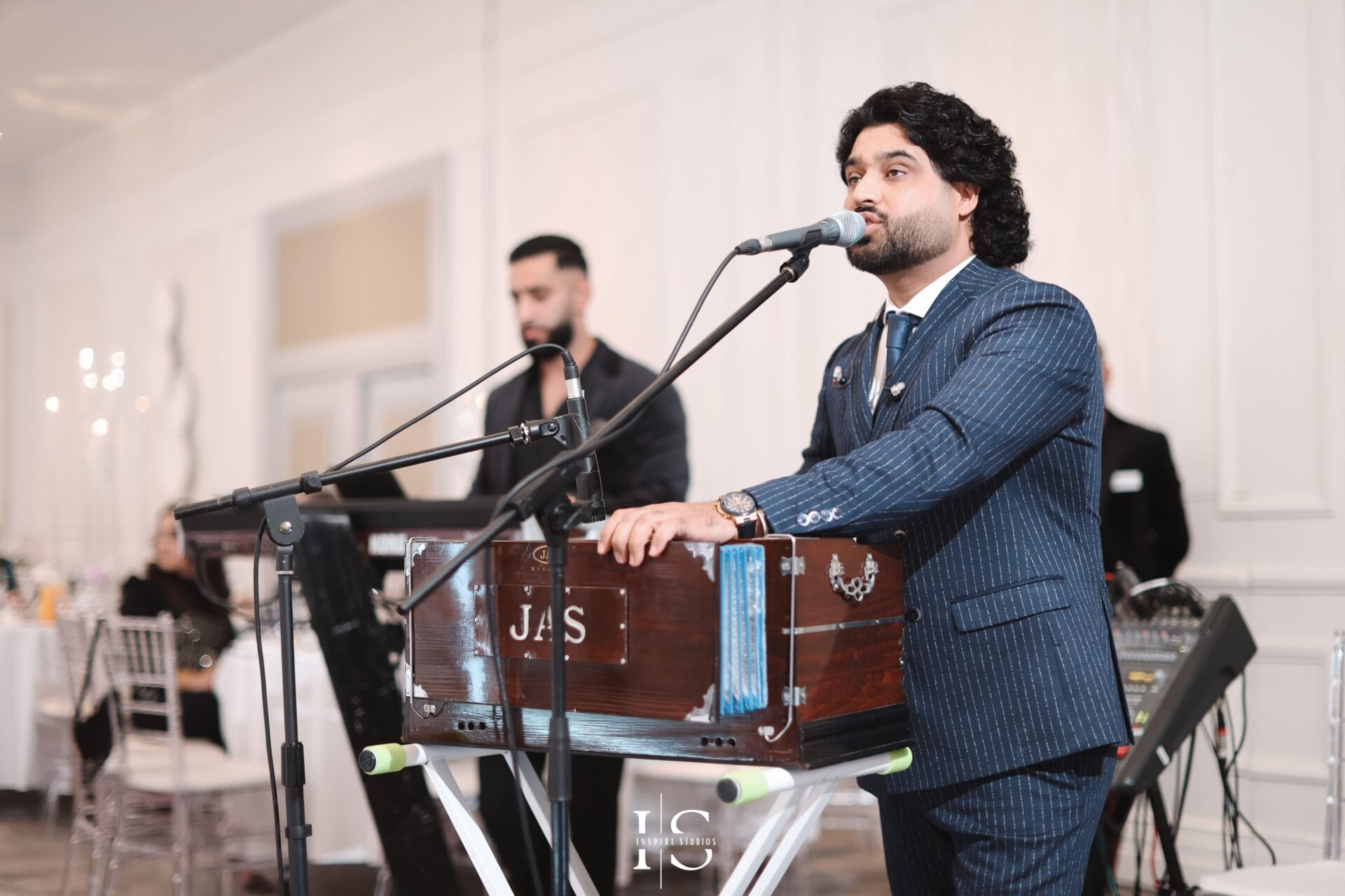 Hamayoun Angar wedding photography performance capturing live music, celebration energy, and luxury wedding entertainment.
