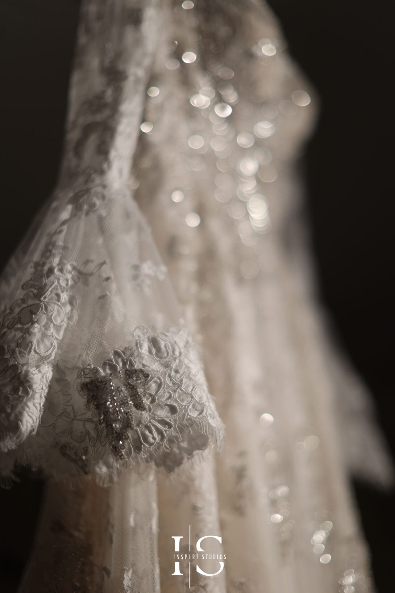 Luxury wedding photography of a bridal dress capturing elegant fabric, designer details, and timeless bridal styling.