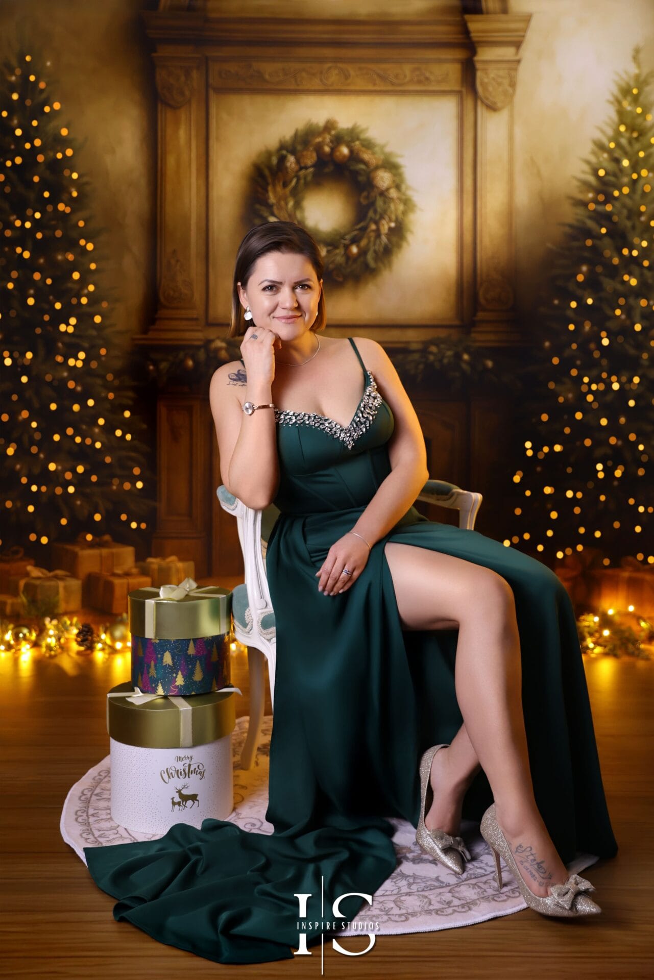 Mother and son Christmas studio portrait with festive background