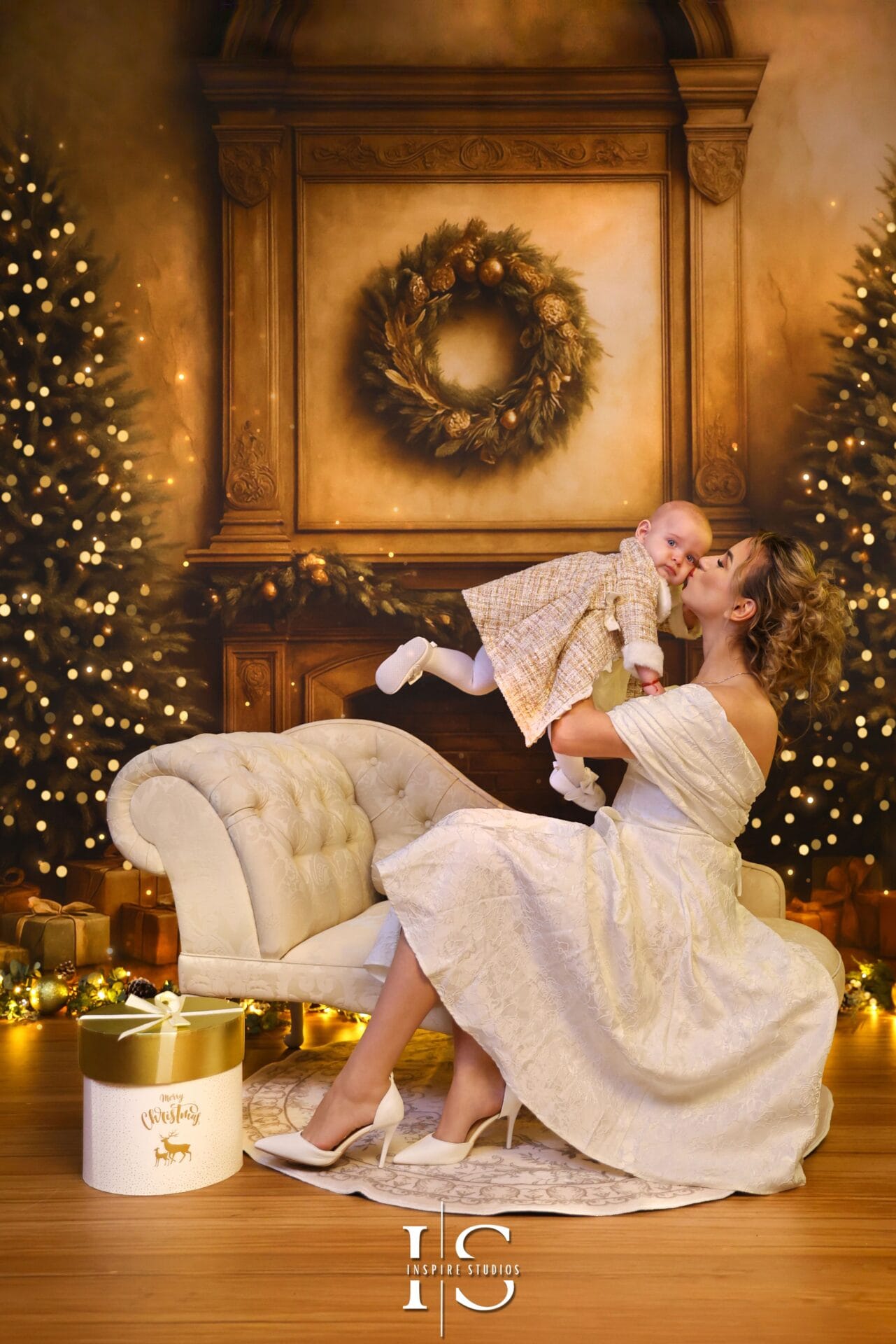 Baby’s first Christmas photography session in a cozy festive studio setting