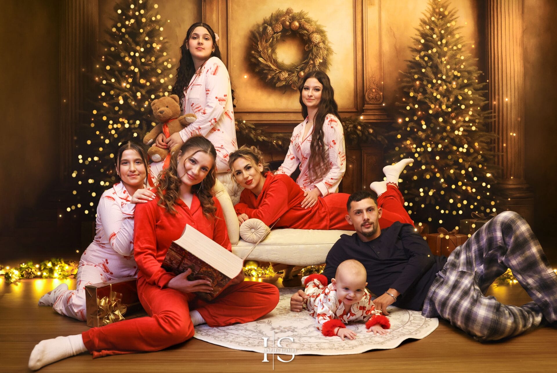 Christmas family pyjamas portraits in a cozy holiday studio