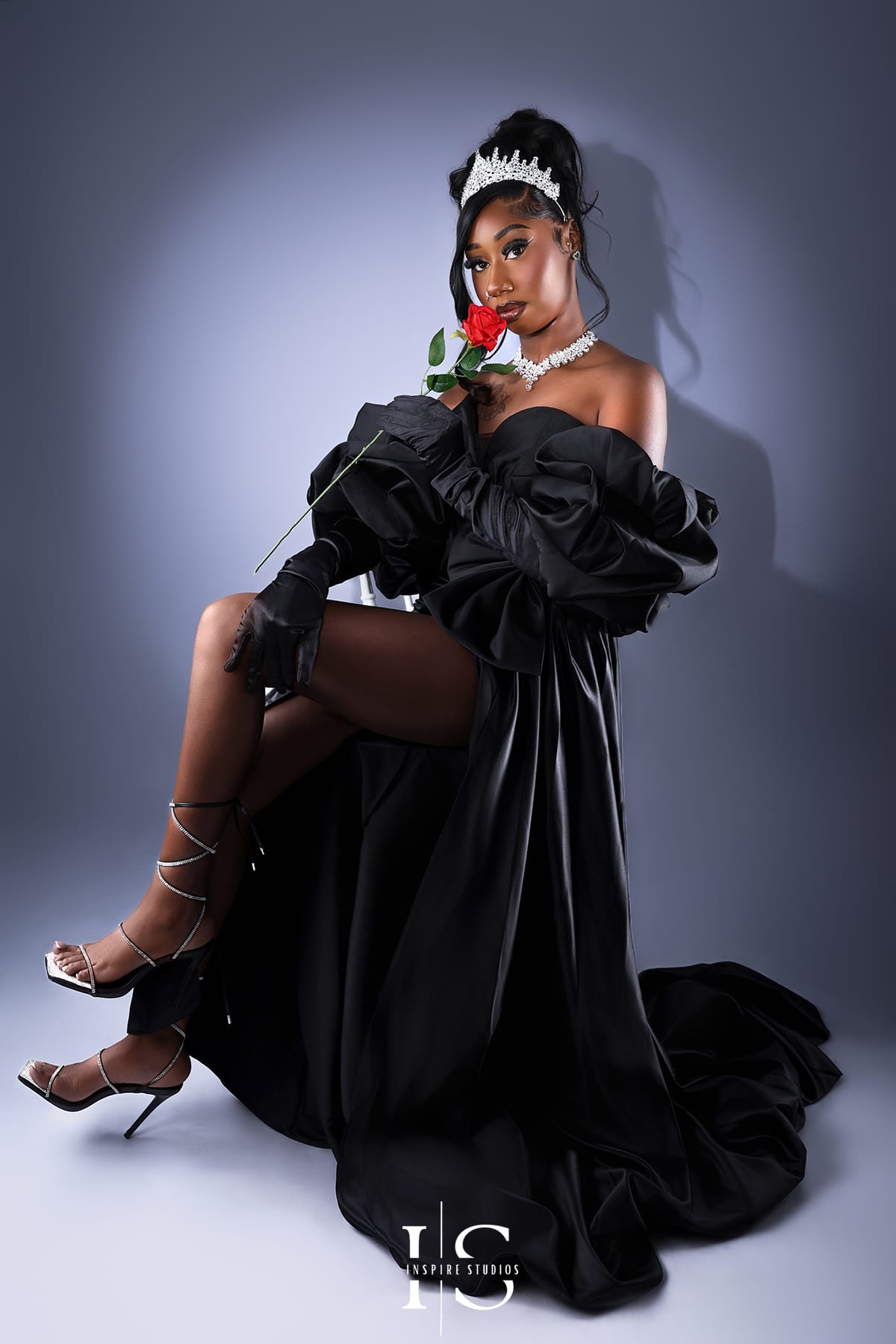 Editorial spotlight birthday portraits in London with dramatic studio lighting.