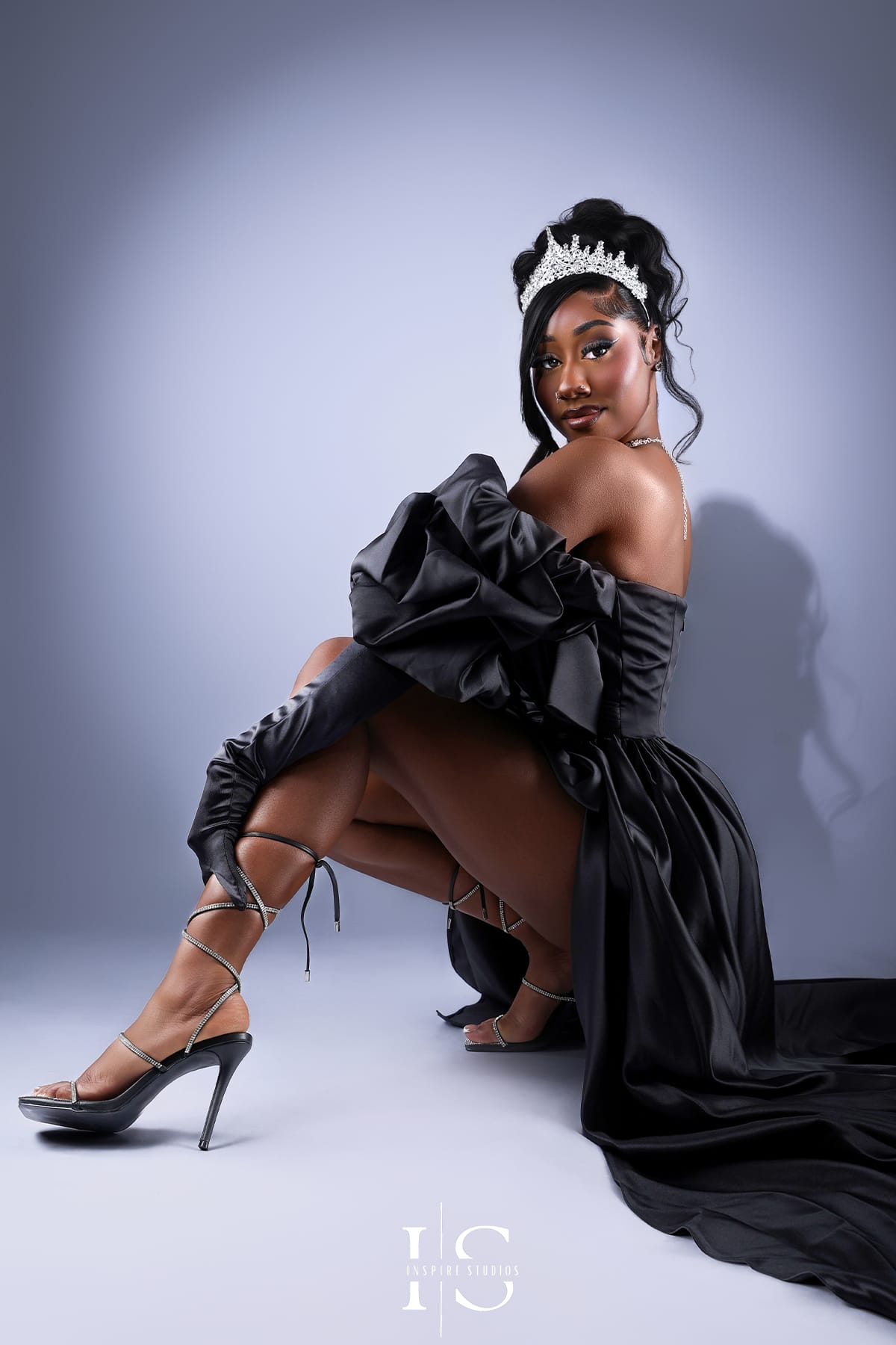 Modern spotlight birthday photography in London with minimal studio lighting.