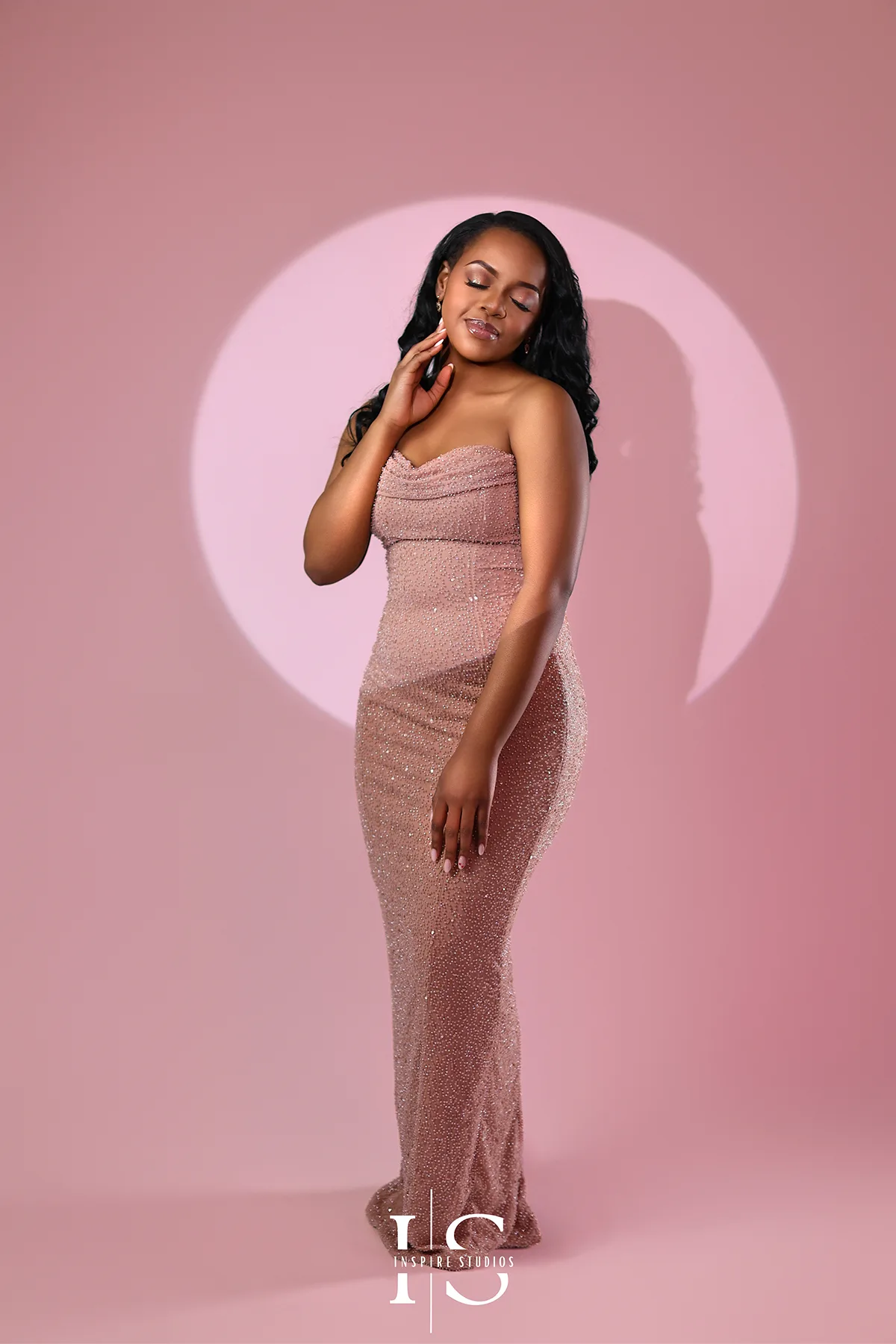 Luxury pink backdrop studio birthday photoshoot with elegant styling and professional lighting setup.