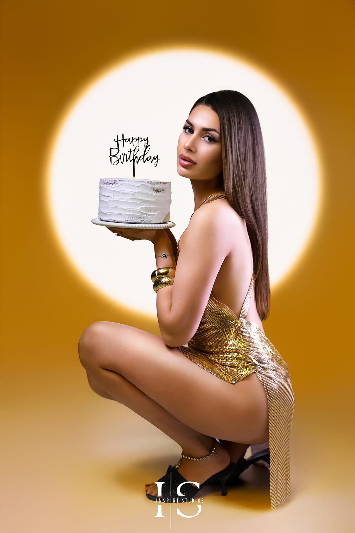 Russian girl celebrating her birthday in a spotlight studio photoshoot with elegant lighting and glamorous styling.