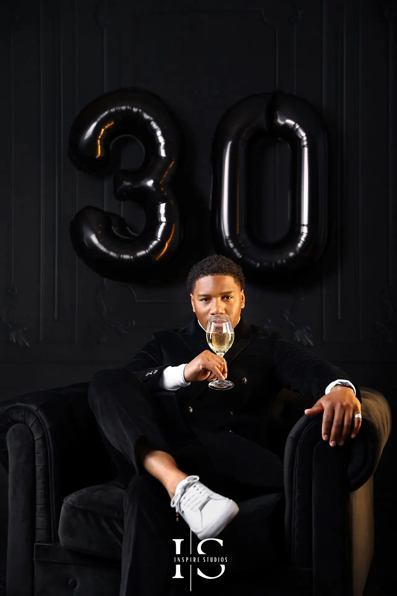 elegant mens 30th birthday portrait holding champagne glass studio photo