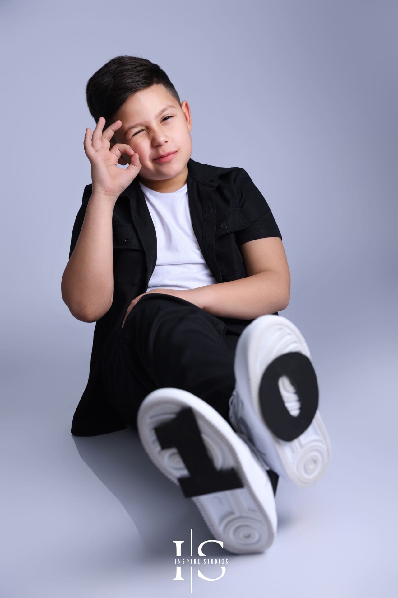 kids birthday photoshoot boy age 10 in London studio with balloons and props