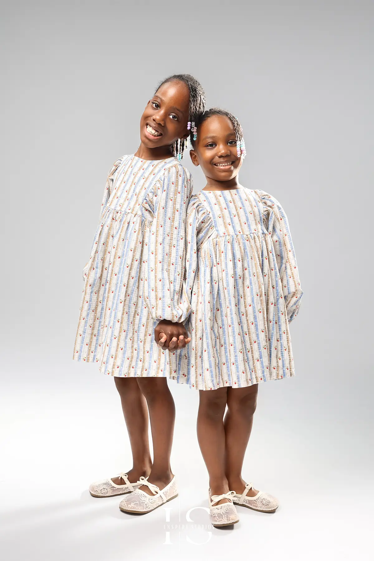 sisters portraits studio photoshoot with natural connection and elegant posing