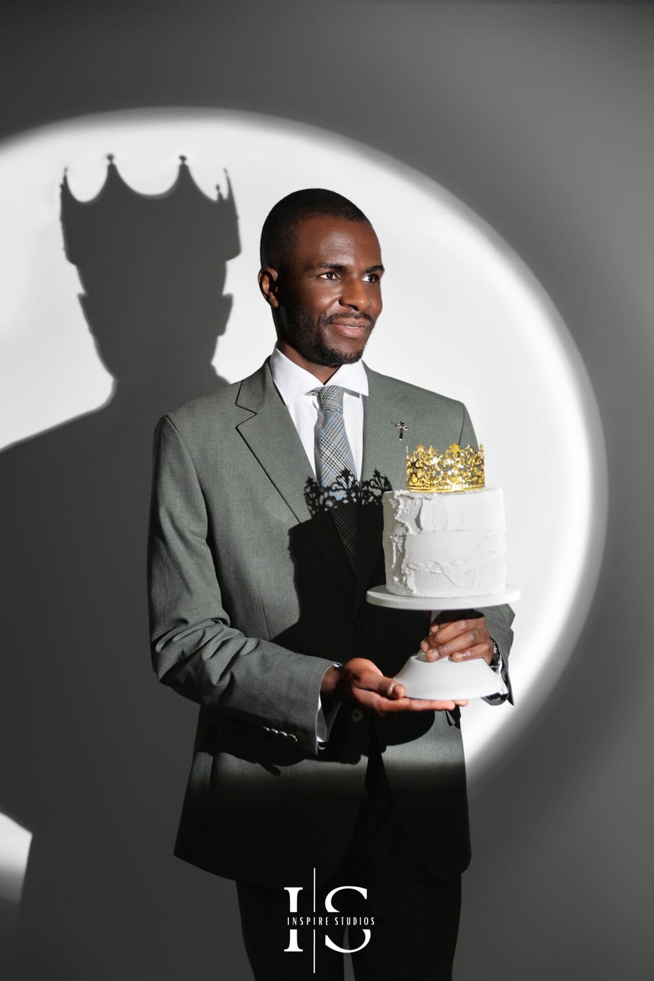 mens birthday photoshoot spotlight lighting with crown portrait