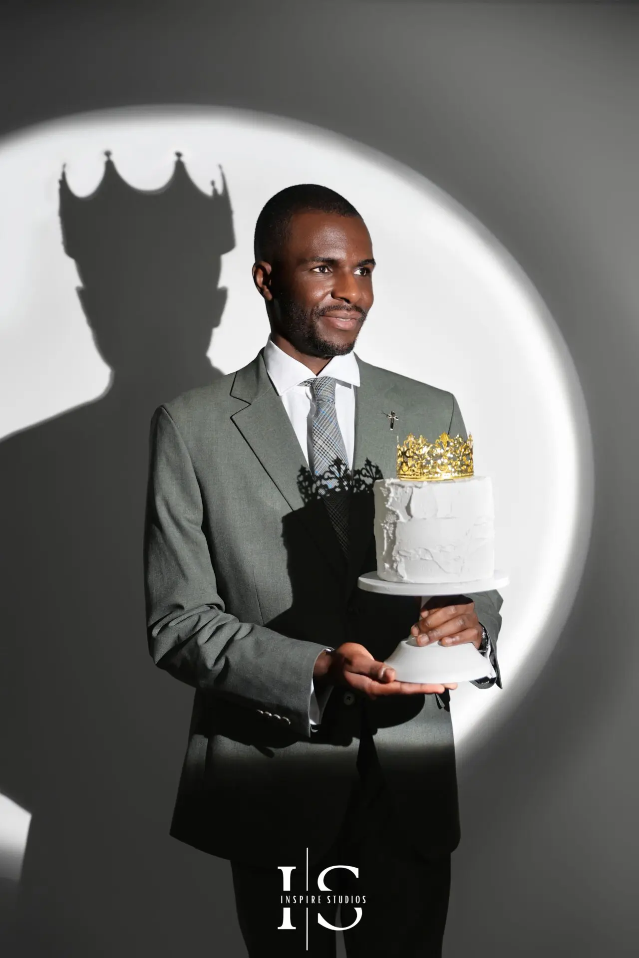 mens birthday photoshoot spotlight lighting with crown portrait