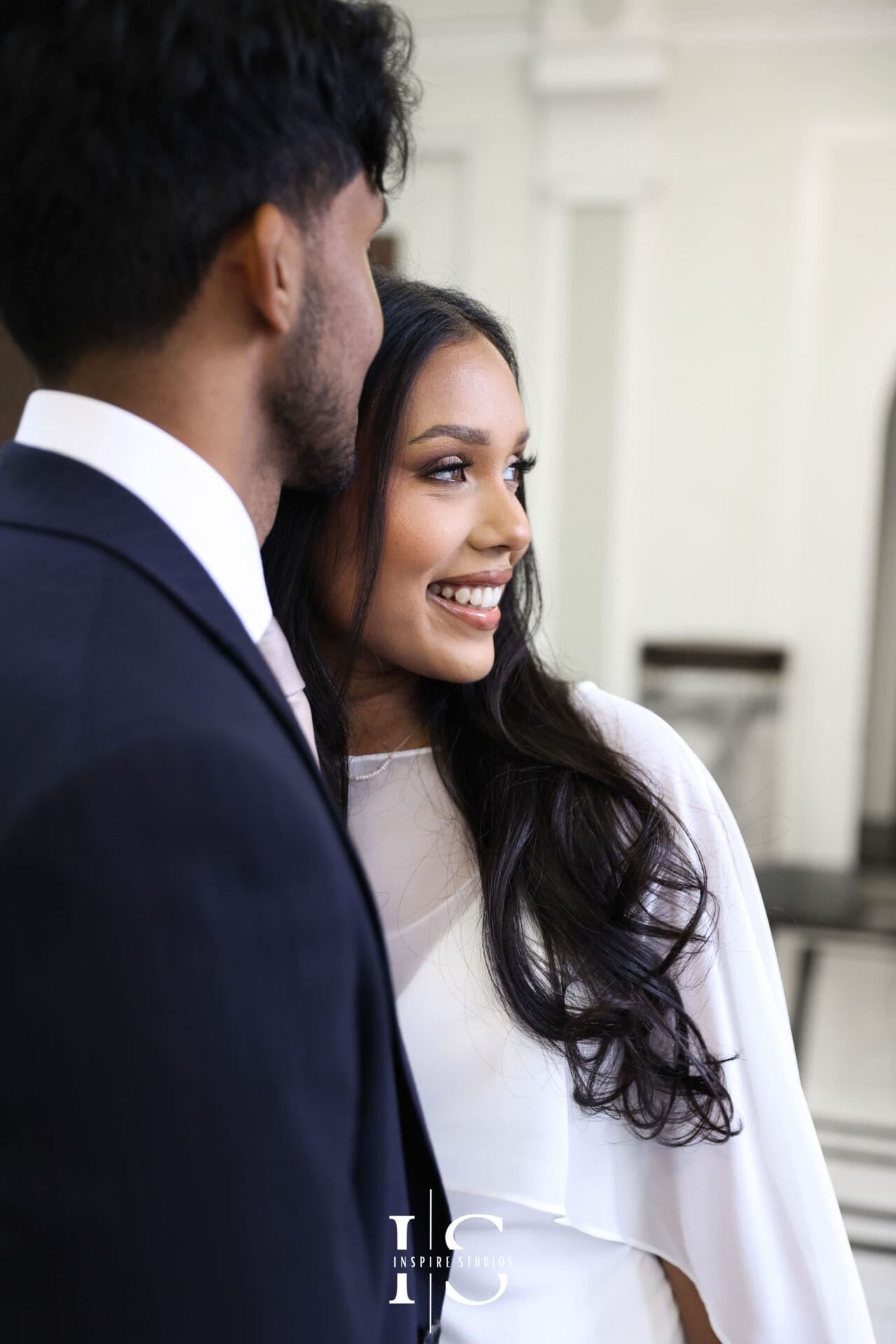 Couple portrait outside Islington Town Hall London with romantic city backdrop