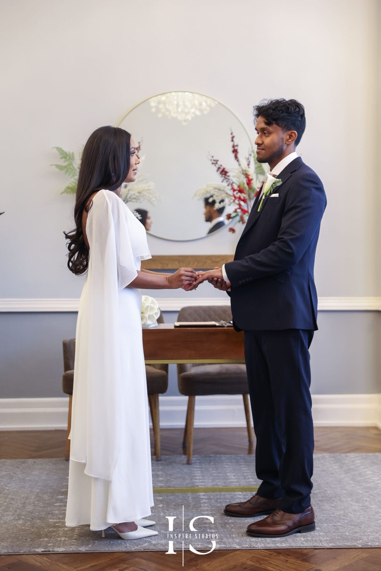 Wedding ceremony at Islington Town Hall London with couple exchanging vows