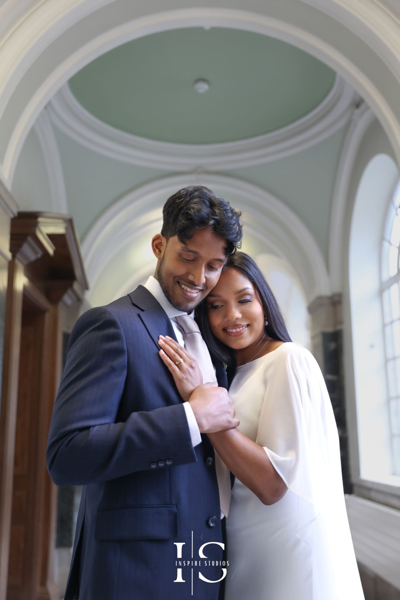 Wedding photographer working at Islington Town Hall London capturing couple