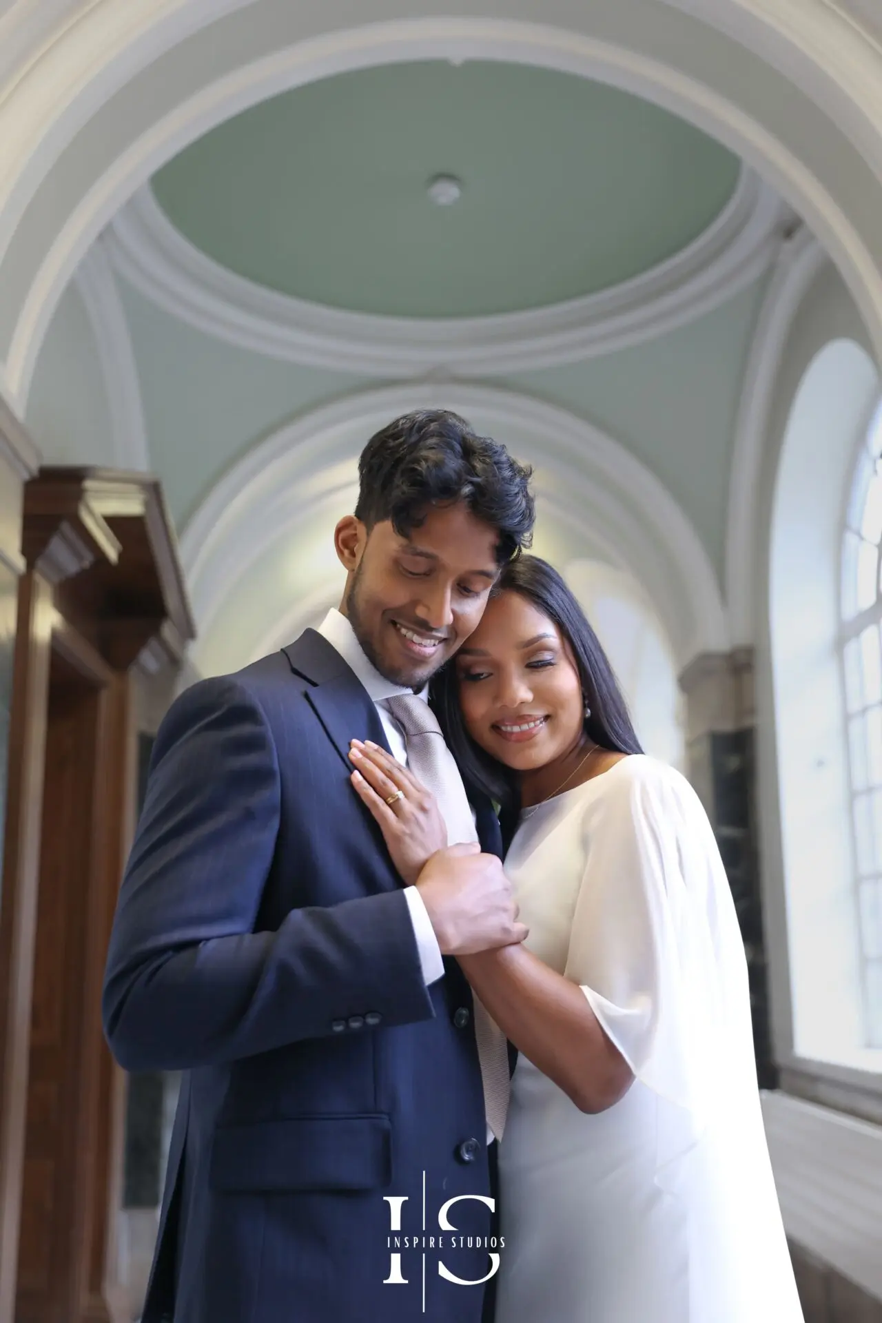 Wedding photographer working at Islington Town Hall London capturing couple