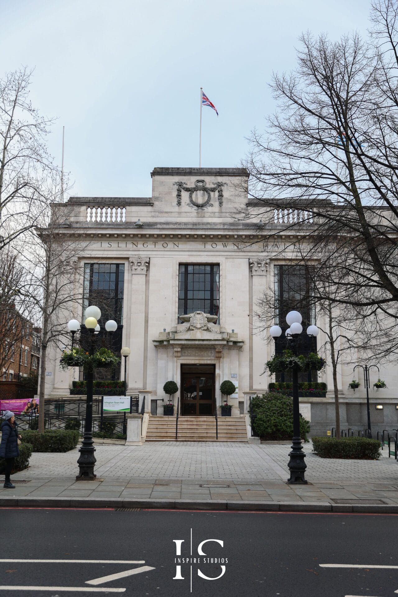 Romantic wedding shot at Islington Town Hall London with couple embracing