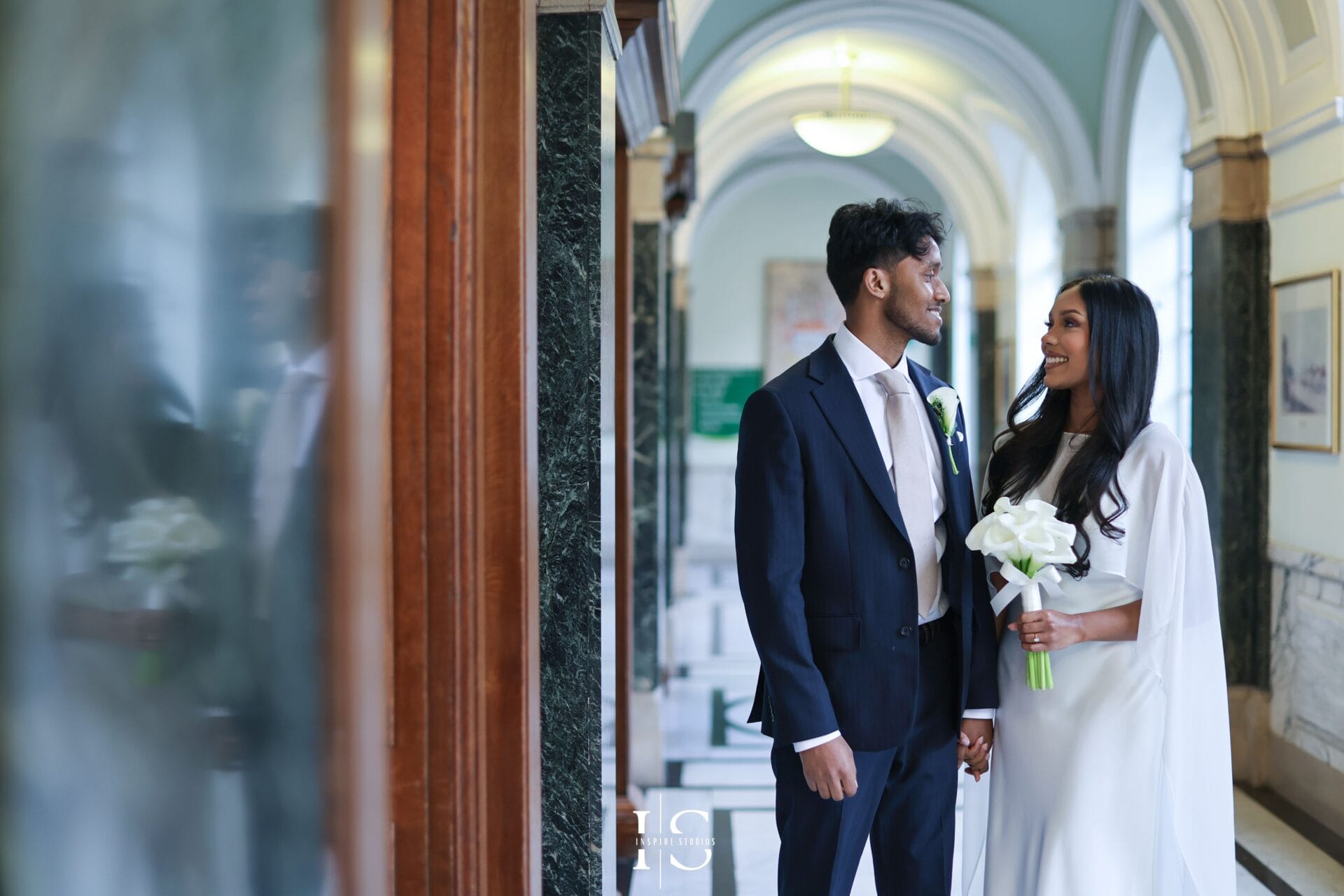 Wedding ceremony moment in Islington London with couple exchanging vows
