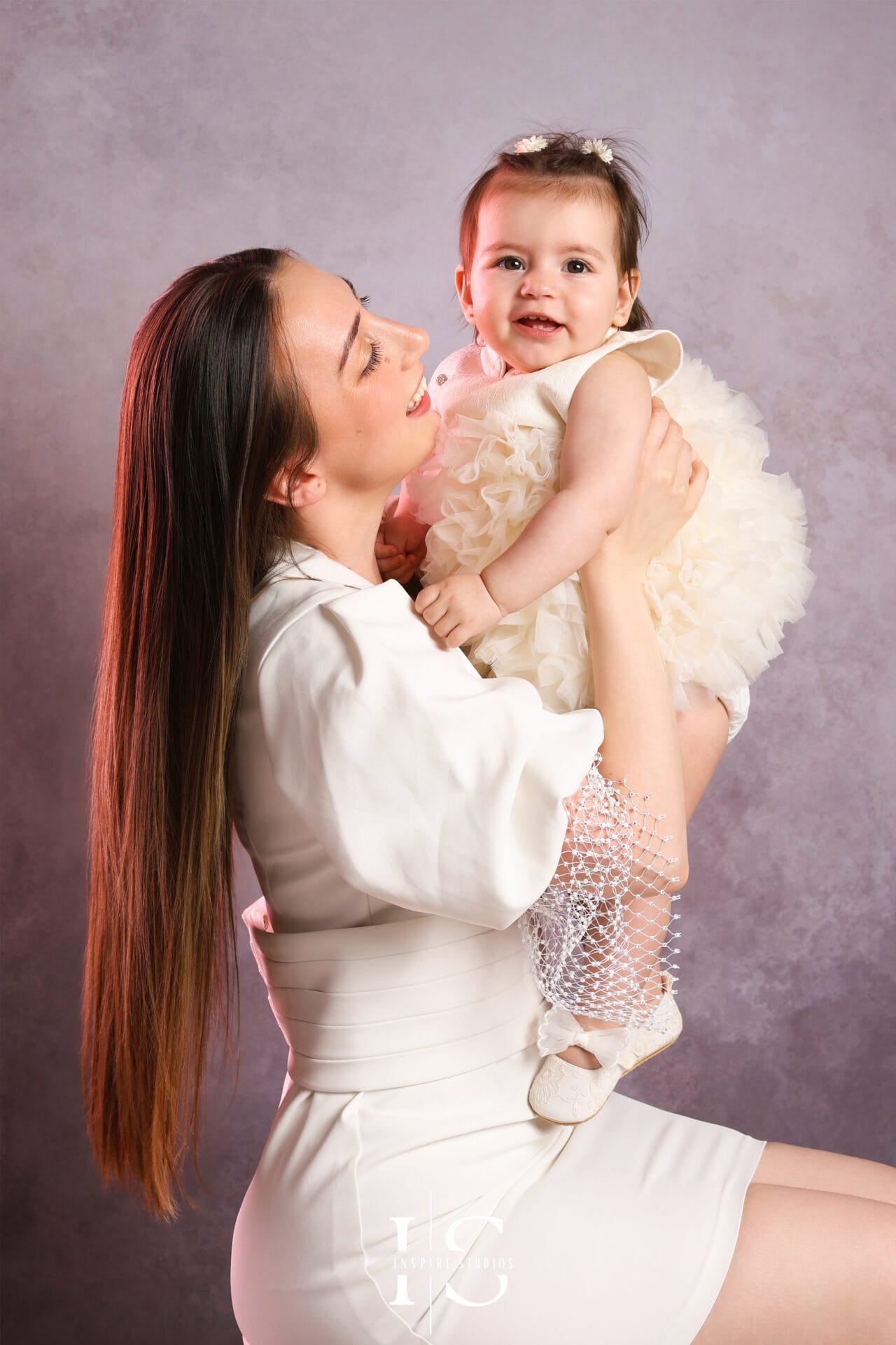 Albanian mother and daughter family photoshoot in London, captured in a warm and elegant studio portrait style.