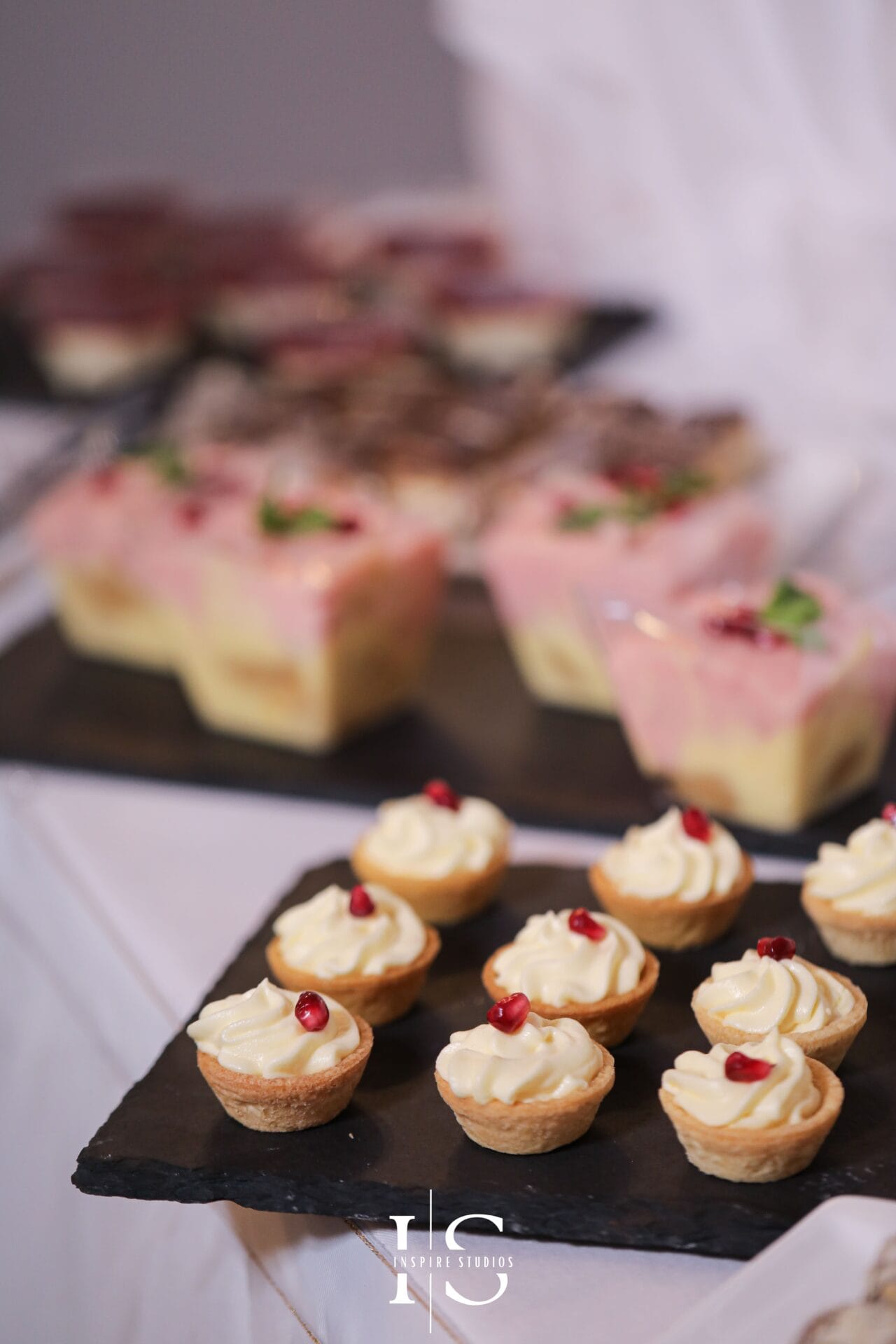 Christening cake and desserts in London arranged for a family celebration venue.