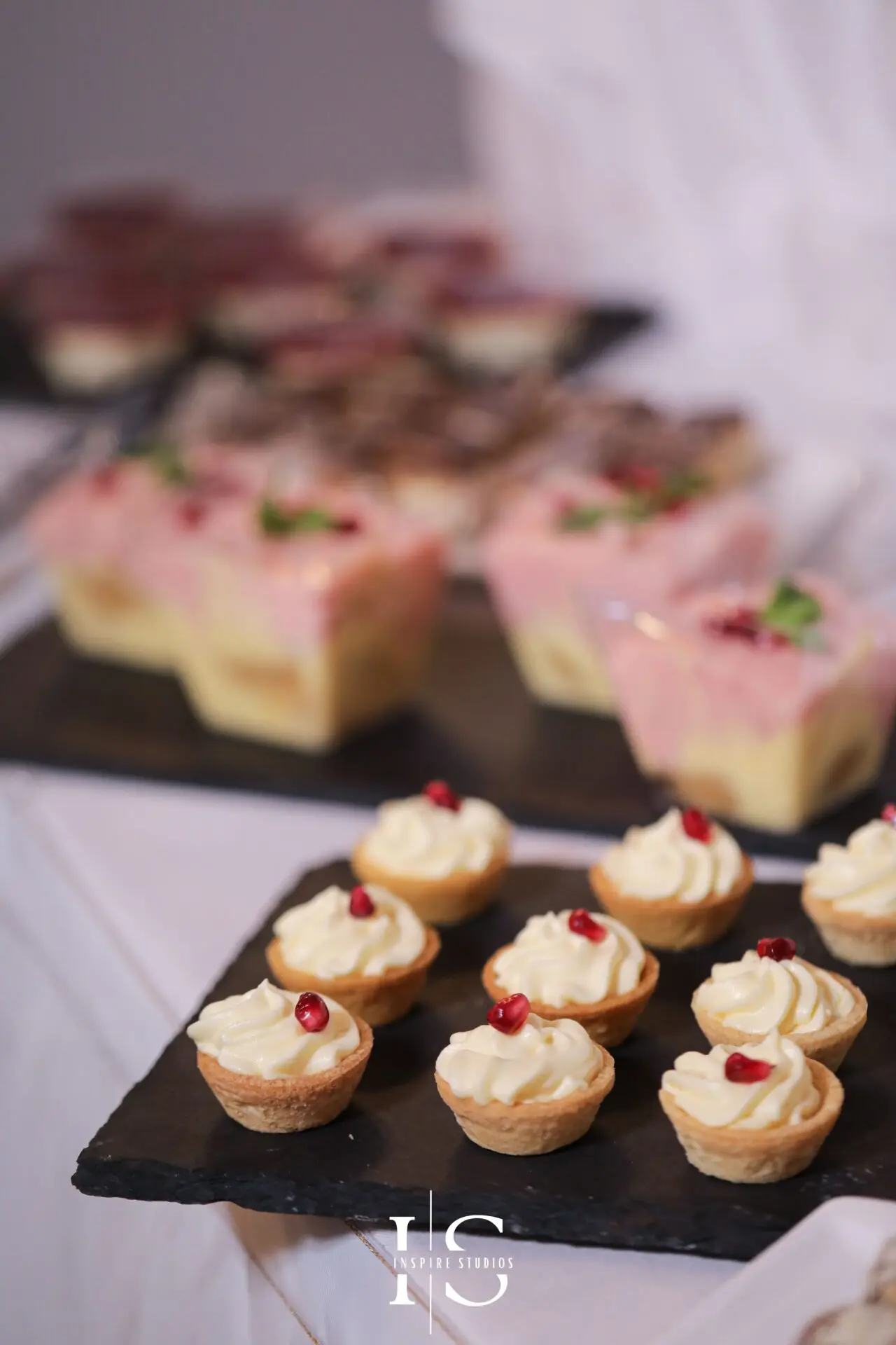 Christening cake and desserts in London arranged for a family celebration venue.
