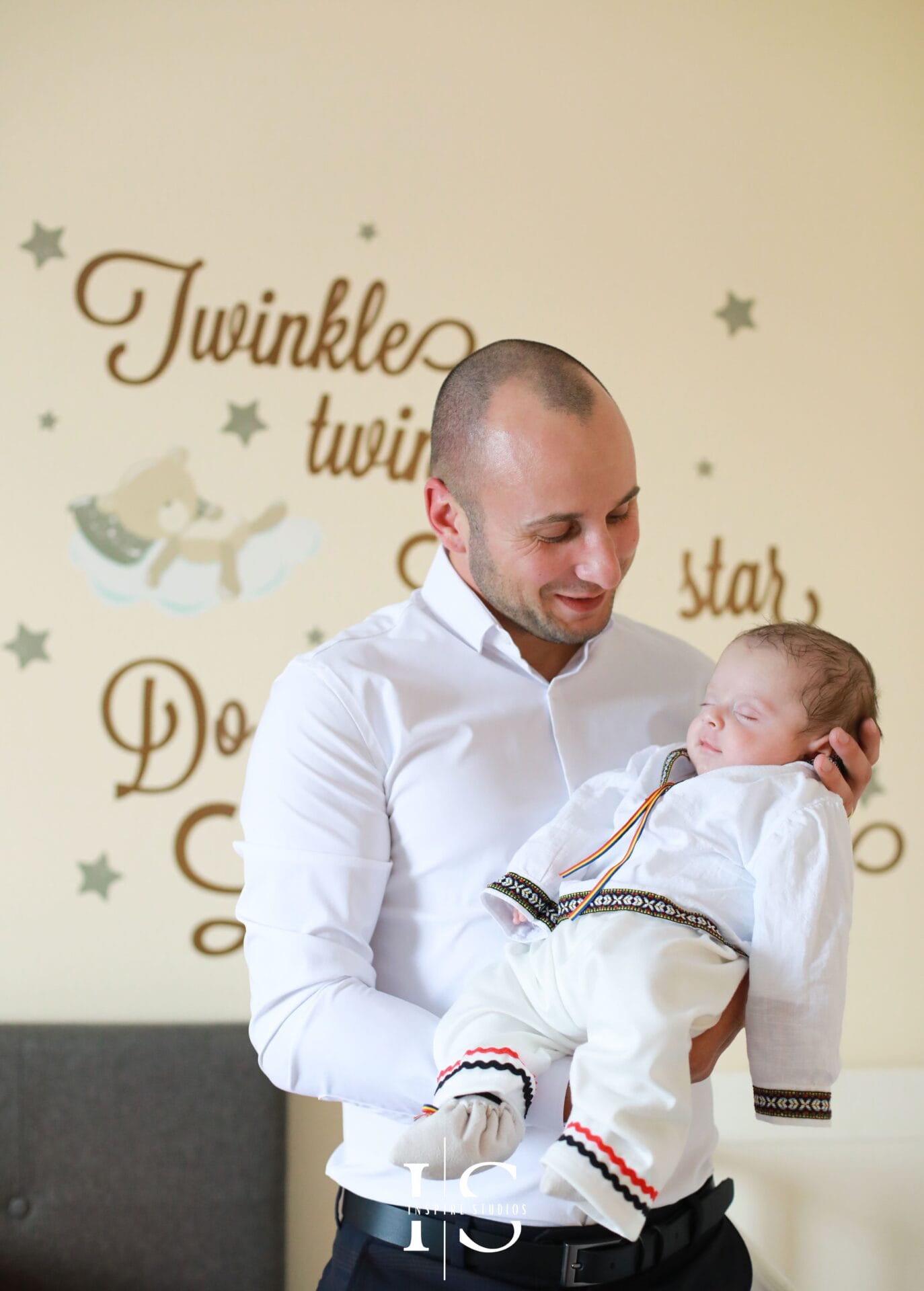 Christening day home photography in London with baby, parents and family before church.