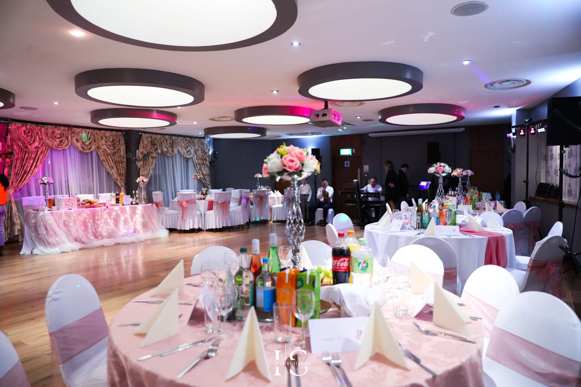 Christening dessert table in London with cake, sweets and celebration decor.