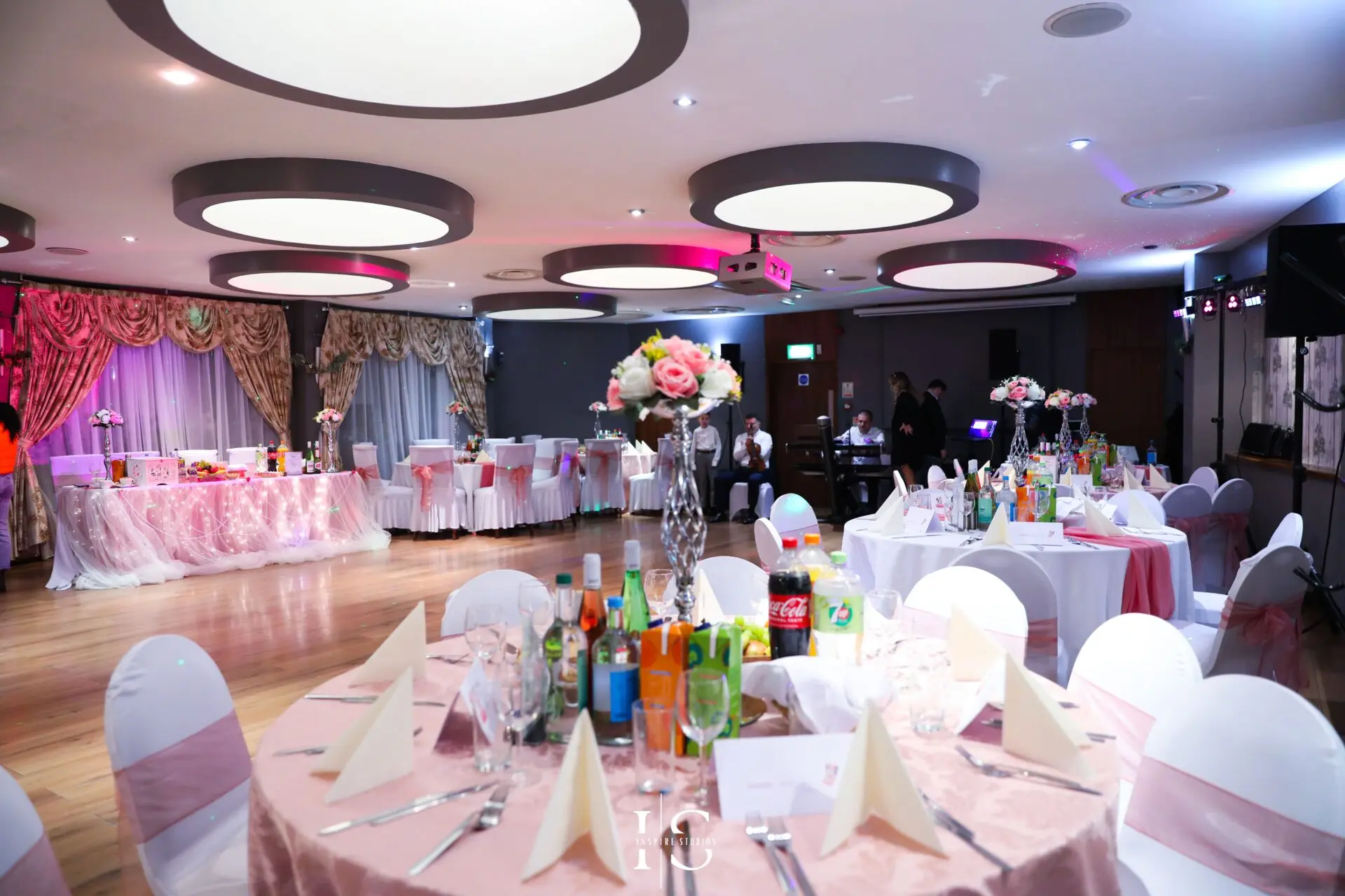 Christening dessert table in London with cake, sweets and celebration decor.
