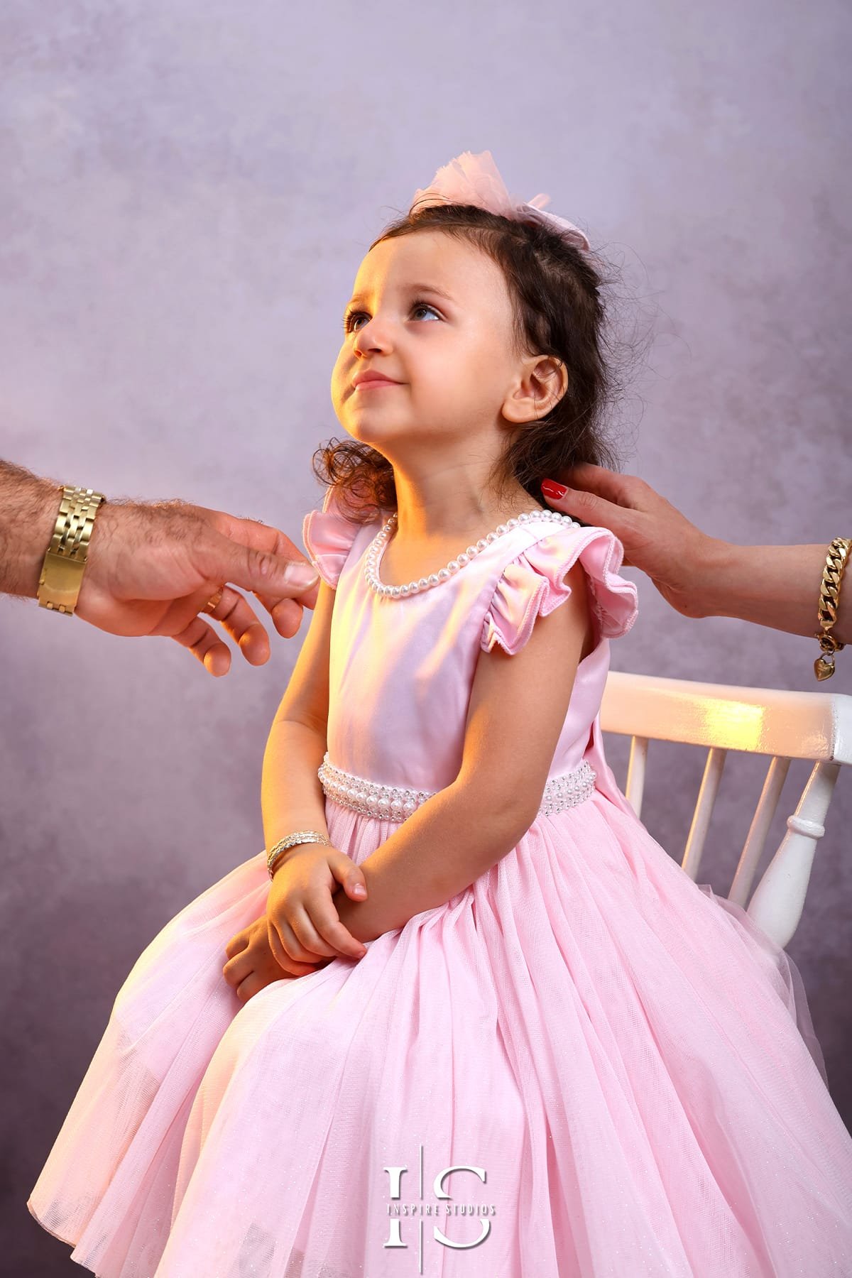 Family photoshoot at Inspire Studios featuring a family posing together for professional studio portraits.
