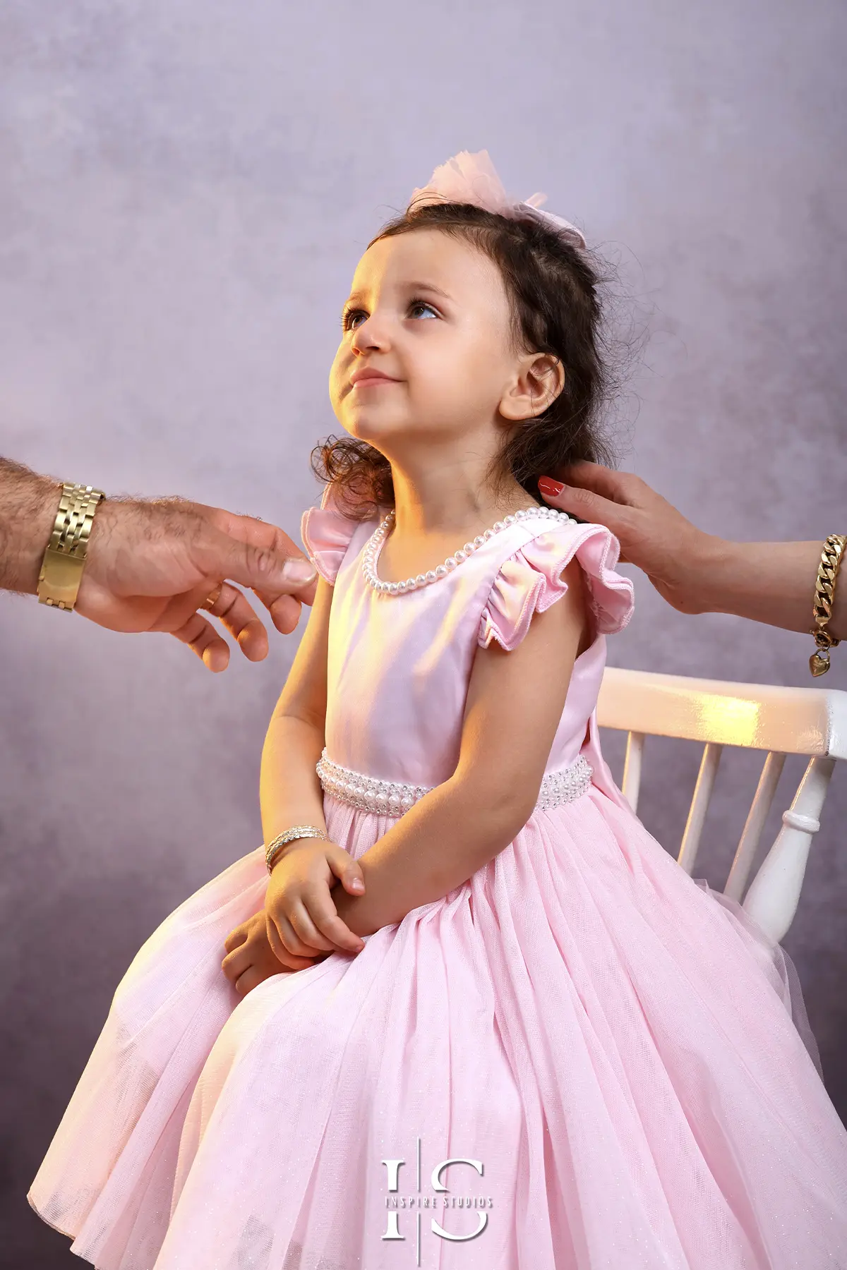Family photoshoot at Inspire Studios featuring a family posing together for professional studio portraits.