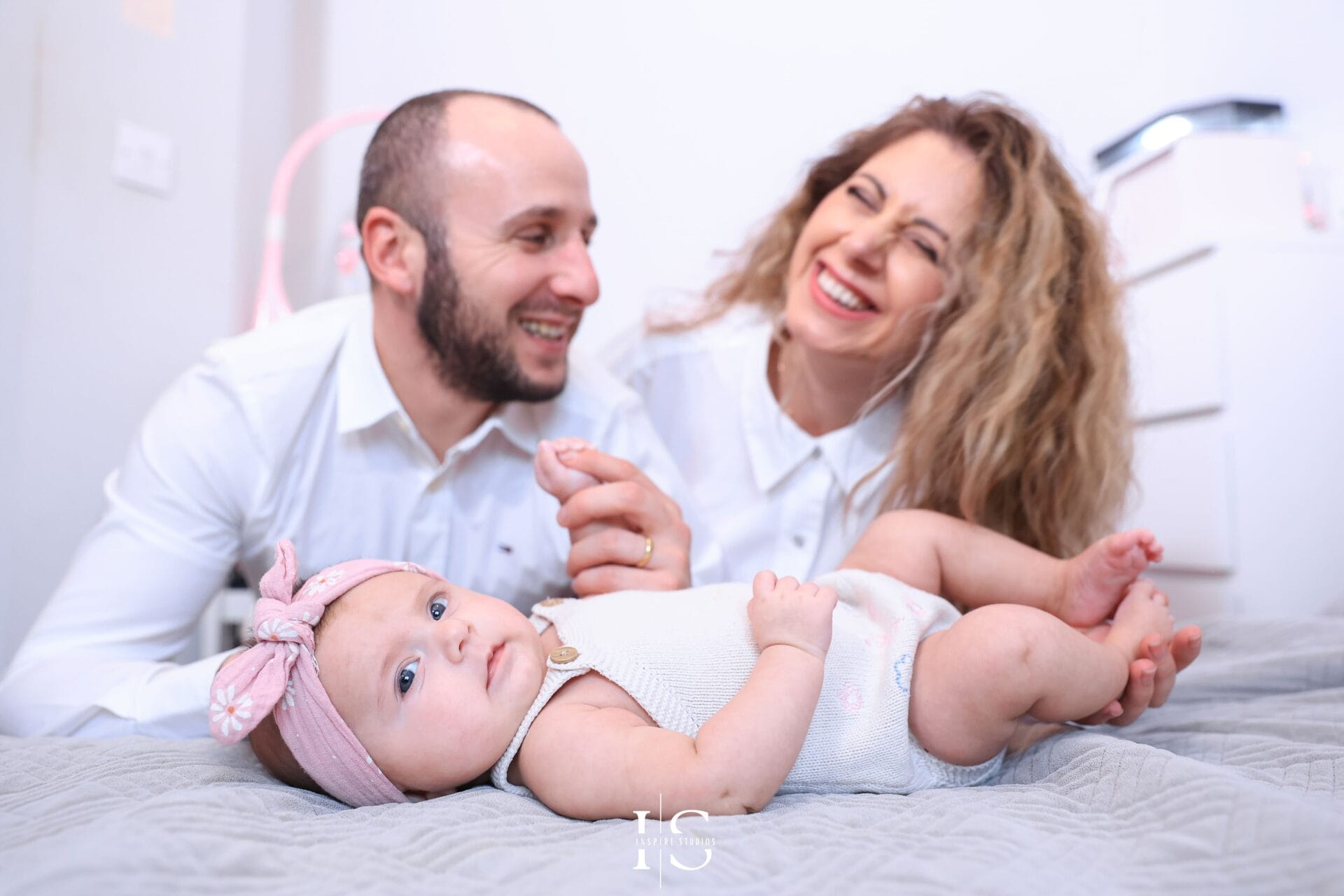 Natural family photography in London at home before a baby christening ceremony.