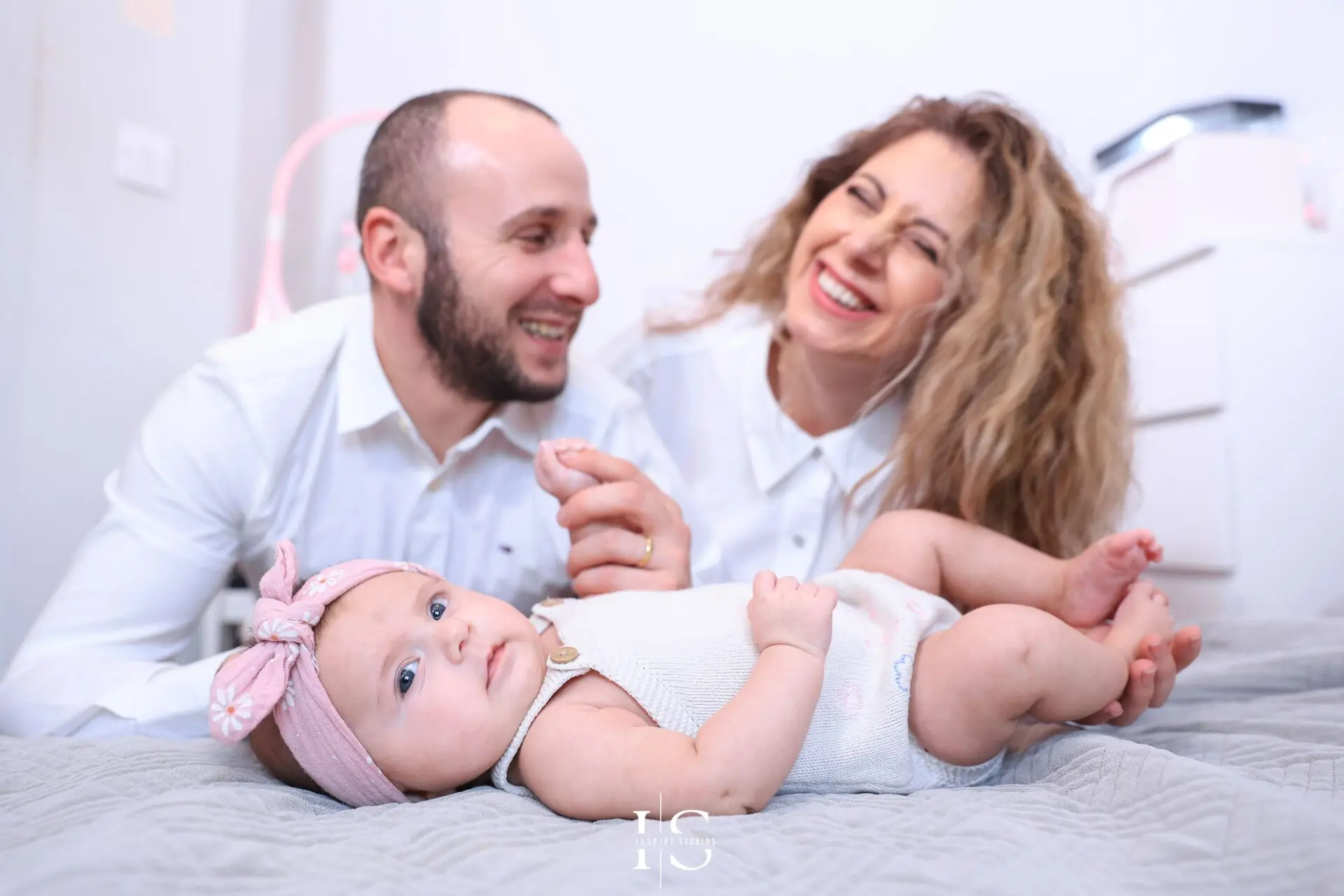 Natural family photography in London at home before a baby christening ceremony.
