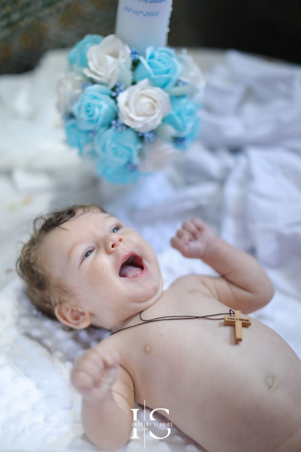 Romanian christening photographer at Parohia Sf. Dimitrie Londra IX, capturing baby, parents and family ceremony moments.