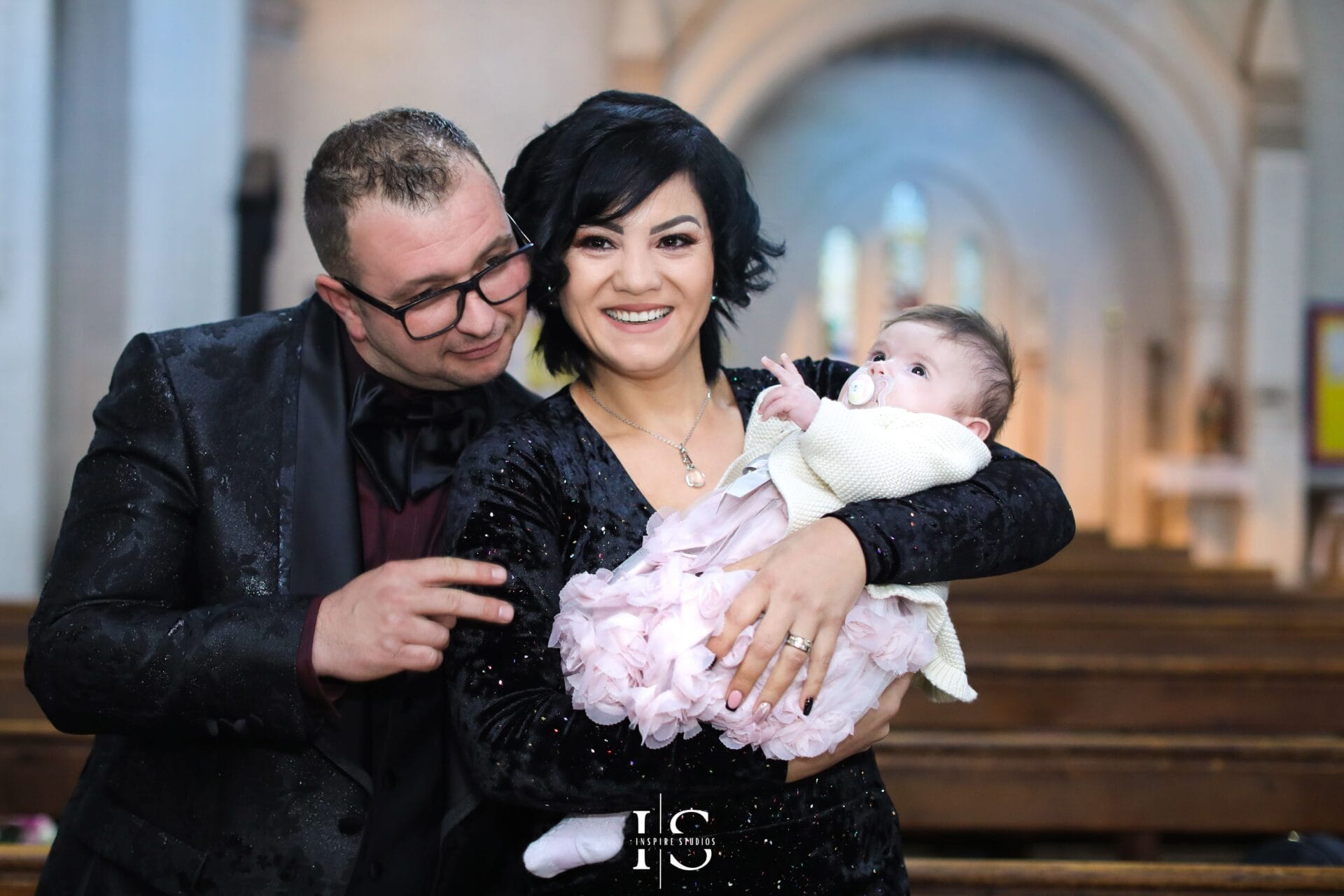 Christening photography at St Margaret and St Columba Church in London with baby and family.