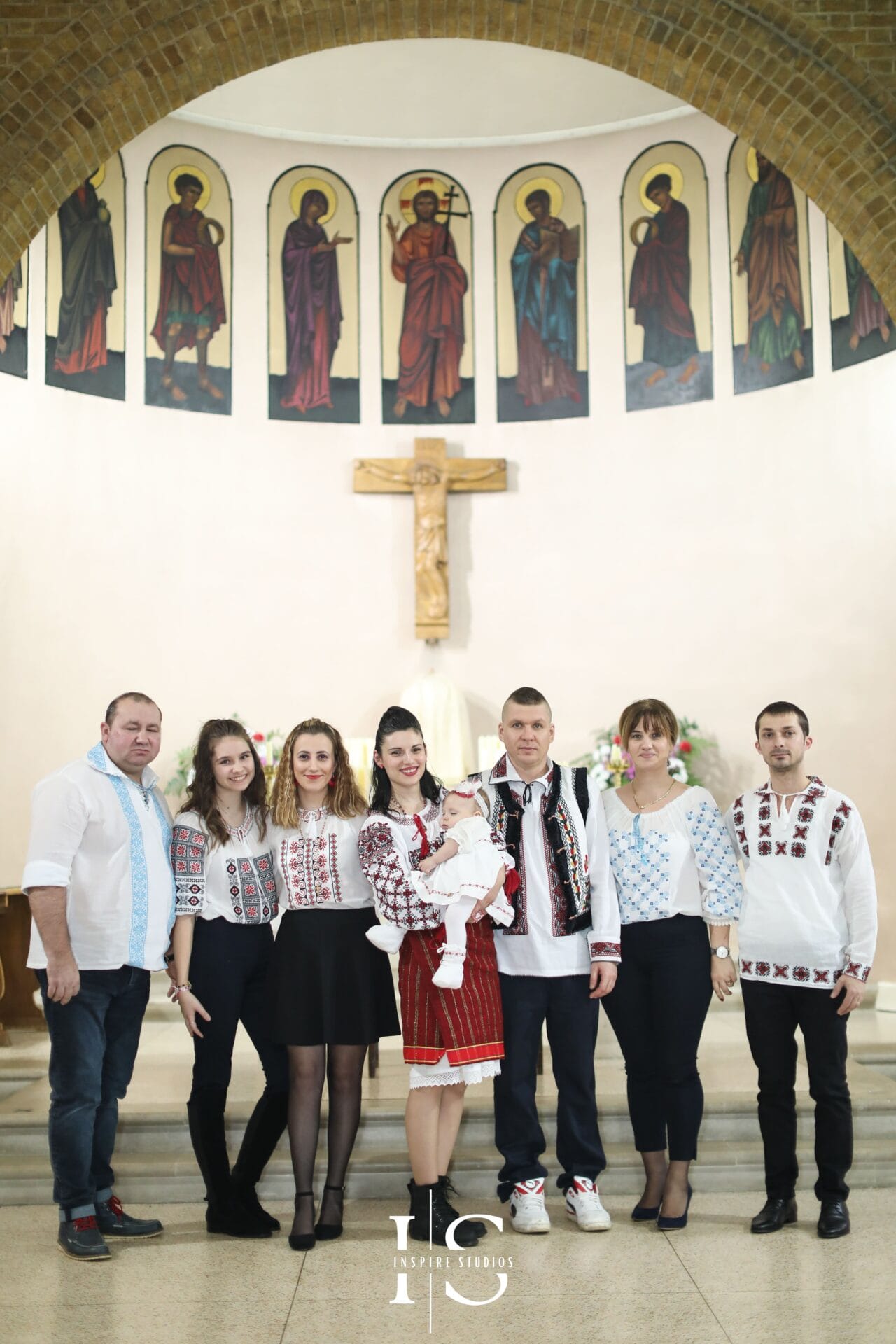 Christening photographer at St Sebastian and Pancras Church capturing natural ceremony moments.