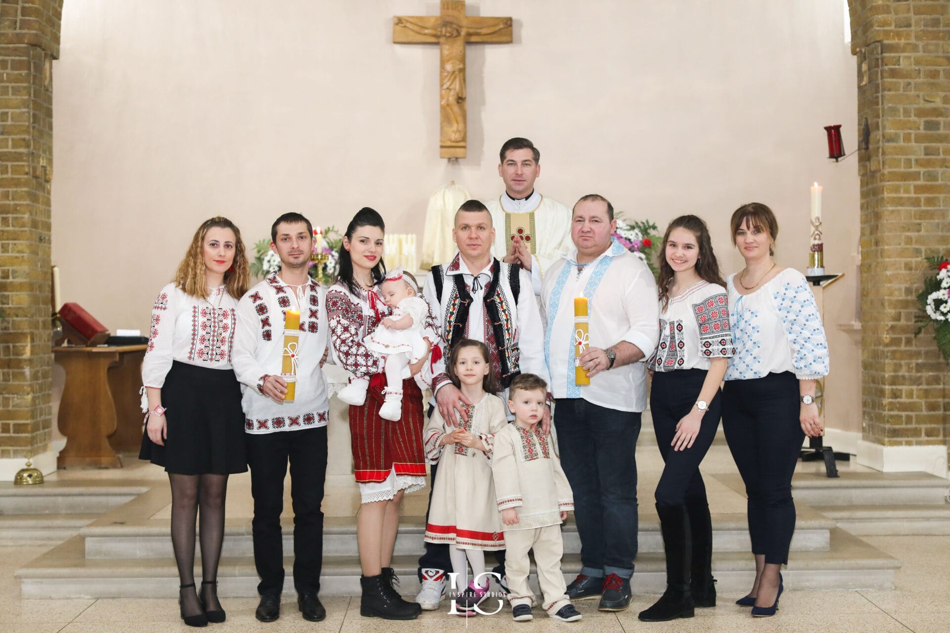 Christening photography at St Sebastian and Pancras Church in London with baby and family.
