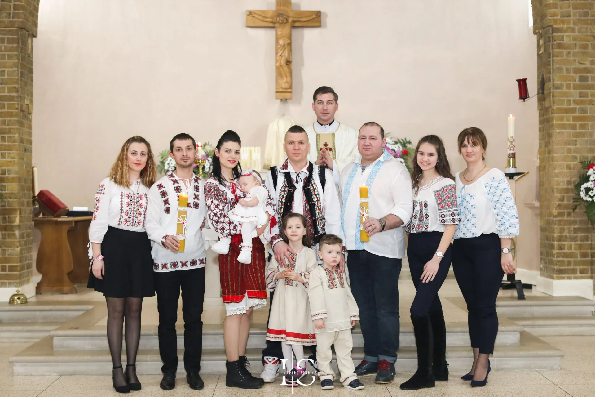 Christening photography at St Sebastian and Pancras Church in London with baby and family.