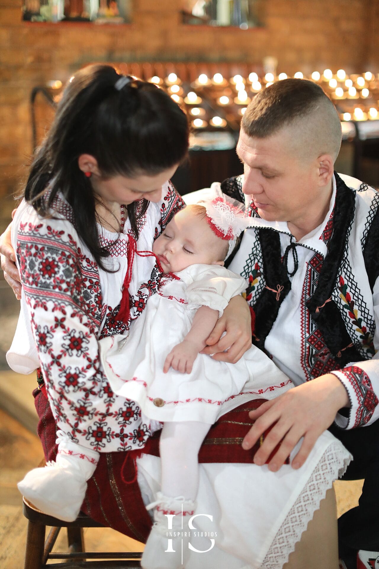 London christening at St Sebastian and Pancras Church with baby, parents and family.