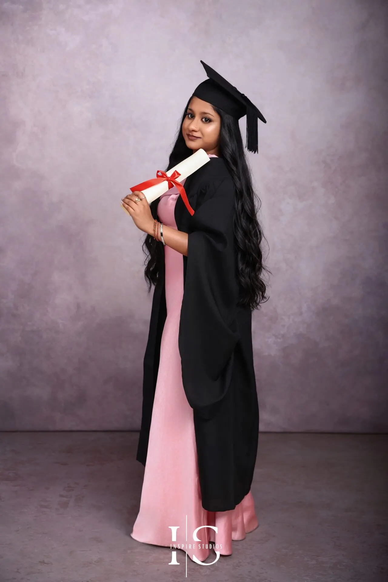 2026 graduation studio portrait ideas in London featuring a graduate posing professionally for a modern university graduation photoshoot.