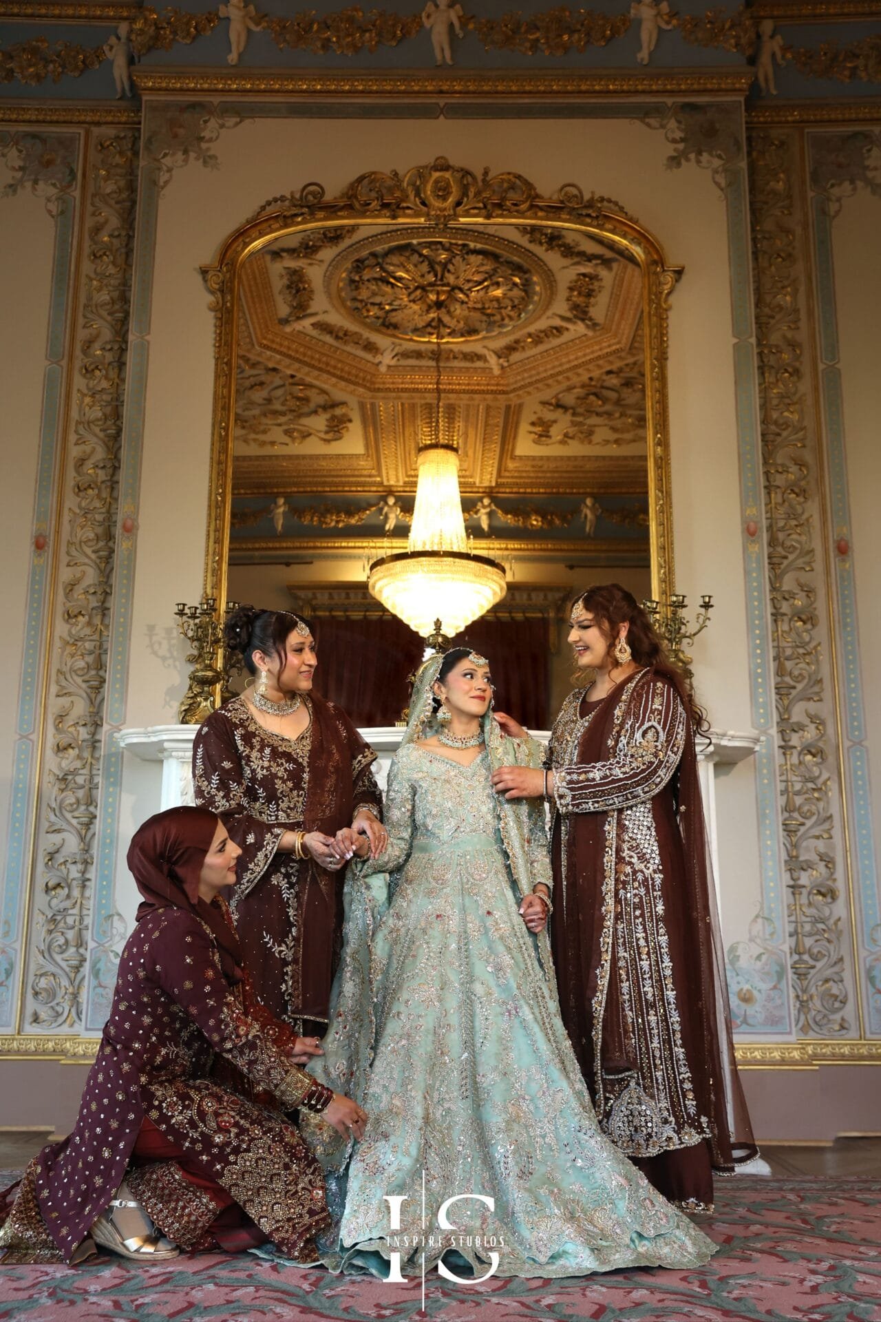 Bride posing with her bridesmaids at Hylands House in Chelmsford.