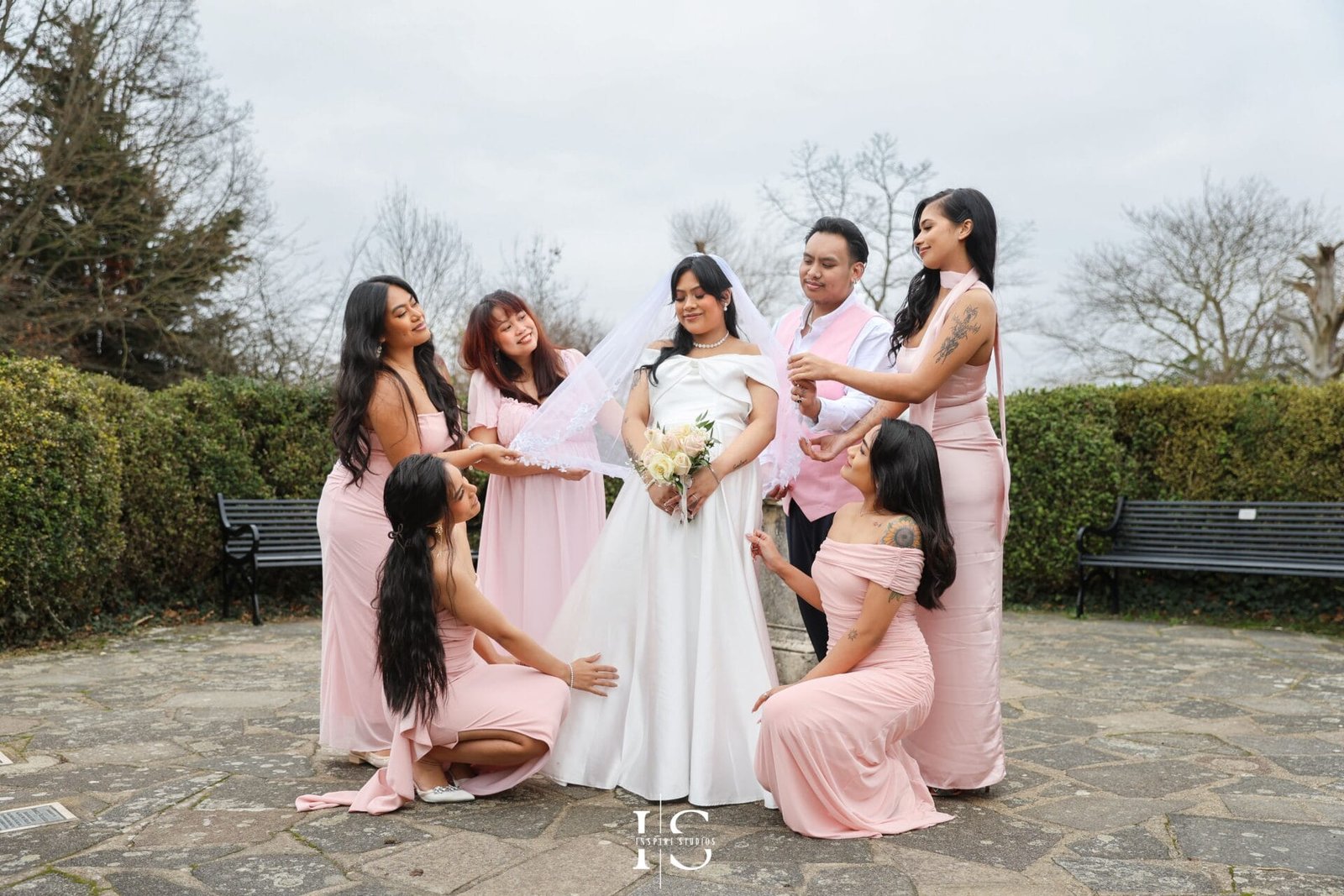 Filipino bride and groom photographed together in the gardens at Danson House following their civil wedding.