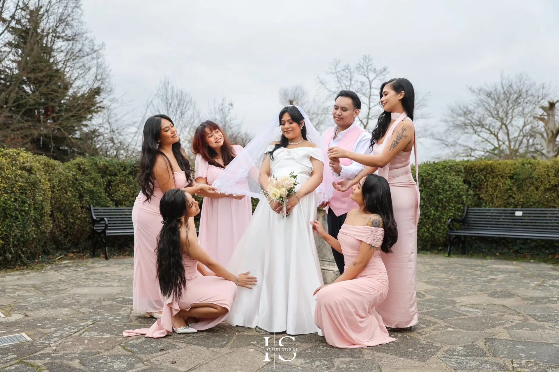 Filipino bride and groom photographed together in the gardens at Danson House following their civil wedding.